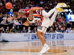 (Trent Nelson | The Salt Lake Tribune)  
New Mexico State Aggies guard Clayton Henry (5) on top of Auburn Tigers guard J'Von McCormick (12) as Auburn faces New Mexico State in the 2019 NCAA Tournament in Salt Lake City on Thursday March 21, 2019.