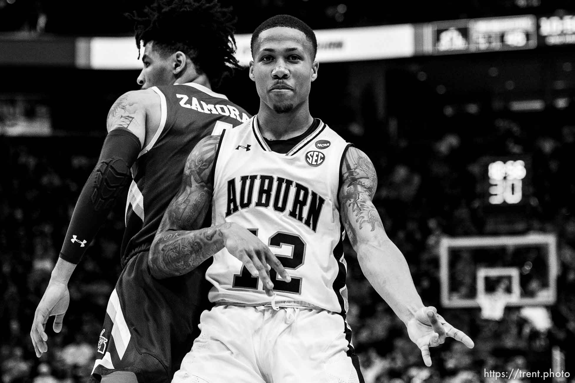 (Trent Nelson | The Salt Lake Tribune)  
Auburn Tigers guard J'Von McCormick (12) plays air guitar to celebrate a basket as Auburn faces New Mexico State in the 2019 NCAA Tournament in Salt Lake City on Thursday March 21, 2019.