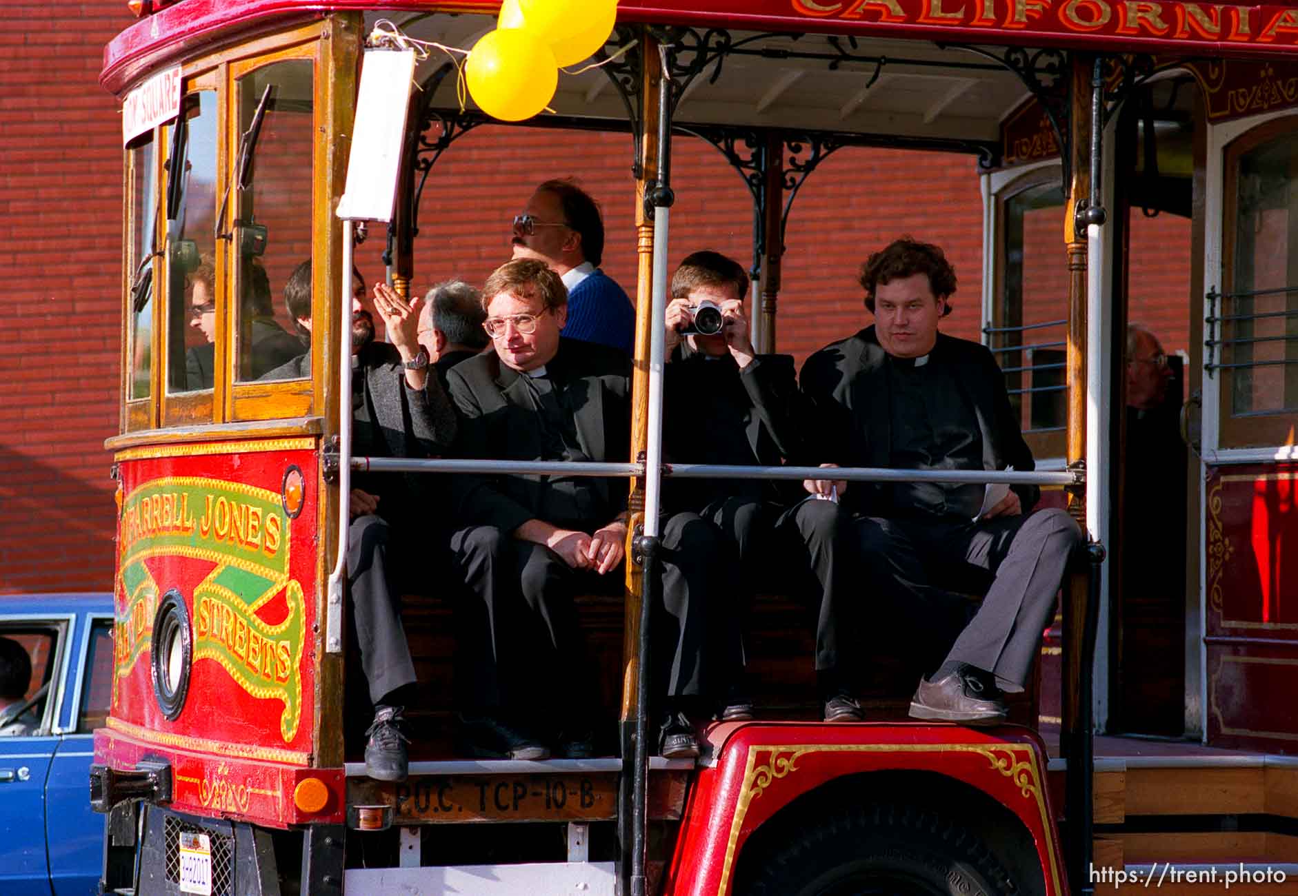 Priests on trolley car (one taking my picture) at the Pope's visit.