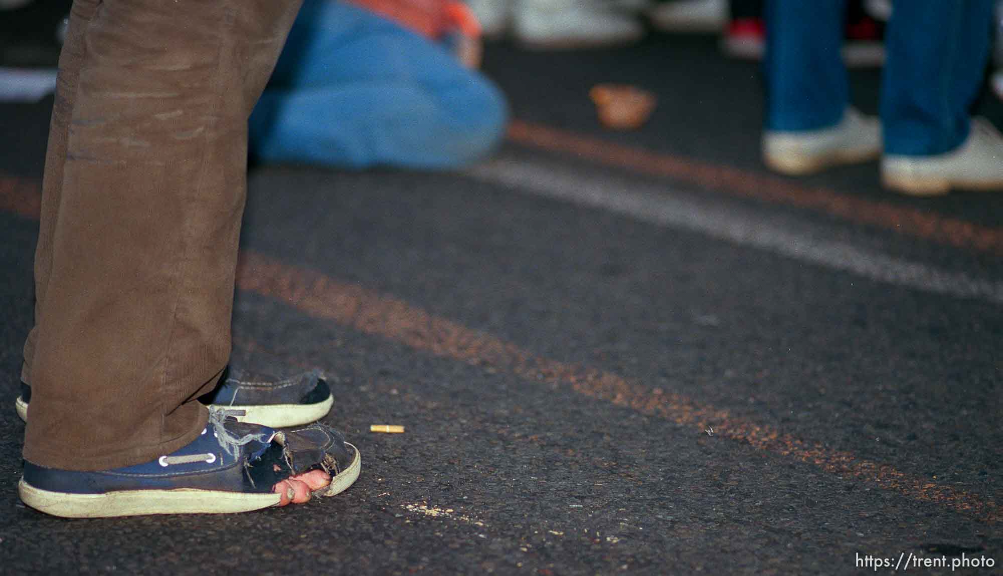 Guy with his toes sticking out of his shoes at the Pope's visit.