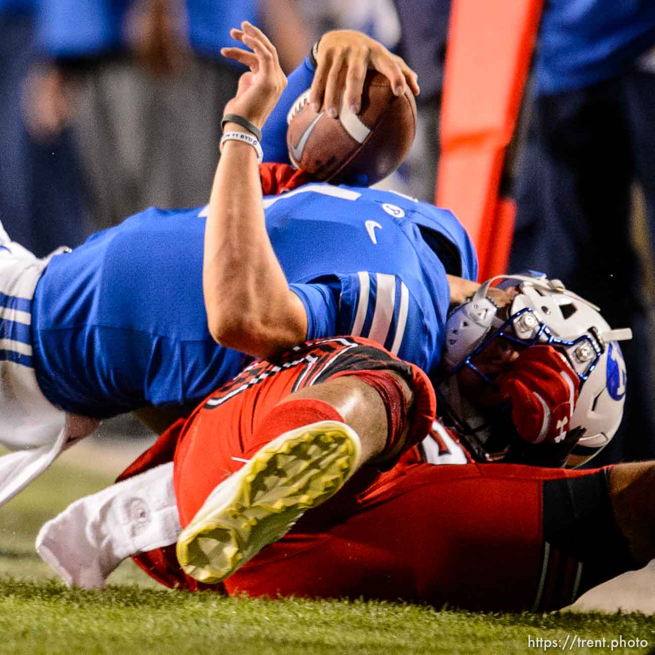 (Trent Nelson  |  The Salt Lake Tribune)  
Utah Utes defensive end Mika Tafua (42) brings down Brigham Young Cougars quarterback Zach Wilson (1) as Brigham Young University (BYU) hosts the University of Utah, NCAA football in Provo on Thursday Aug. 29, 2019.