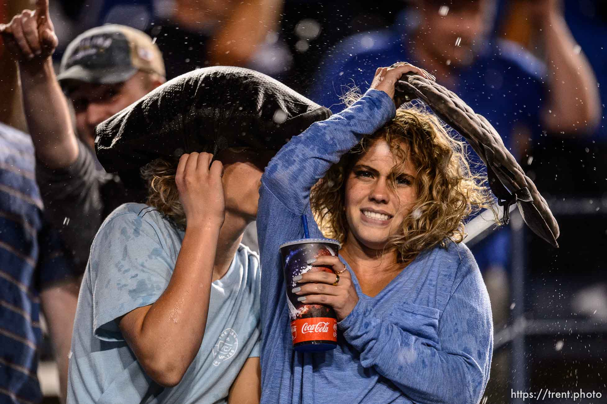 (Trent Nelson  |  The Salt Lake Tribune)  
Rain pours down on BYU fans during a lightning delay as Brigham Young University (BYU) hosts the University of Utah, NCAA football in Provo on Thursday Aug. 29, 2019.