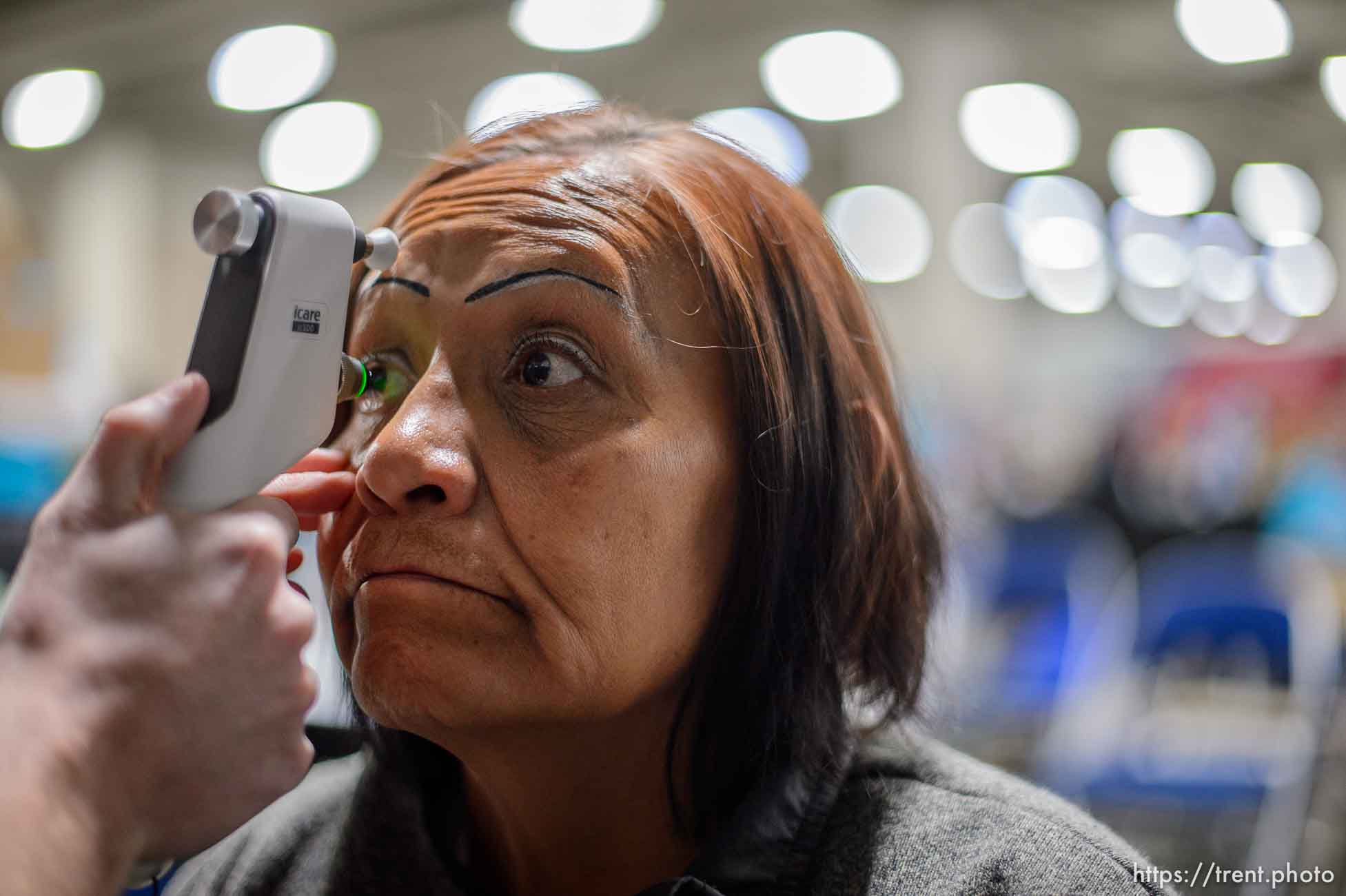 (Trent Nelson  |  The Salt Lake Tribune)
Gloria Red Bear has an eye exam, leading to a free pair of glasses at Project Homeless Connect, where community volunteers to provide services for individuals and families experiencing homelessness, at the Salt Palace Convention Center in Salt Lake City on Friday Oct. 25, 2019.