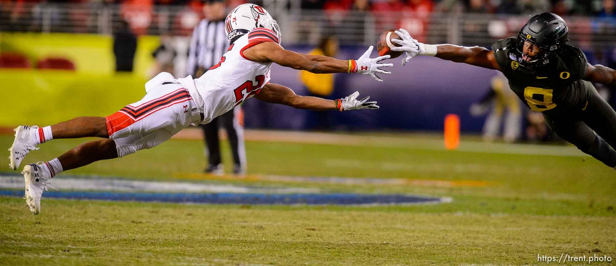 (Trent Nelson  |  The Salt Lake Tribune)
Utah Utes wide receiver Jaylen Dixon (25) and Oregon Ducks safety Jevon Holland (8) dive for the ball as Utah faces Oregon in the Pac-12 football championship game in Santa Clara, Calif., on Friday Dec. 6, 2019.