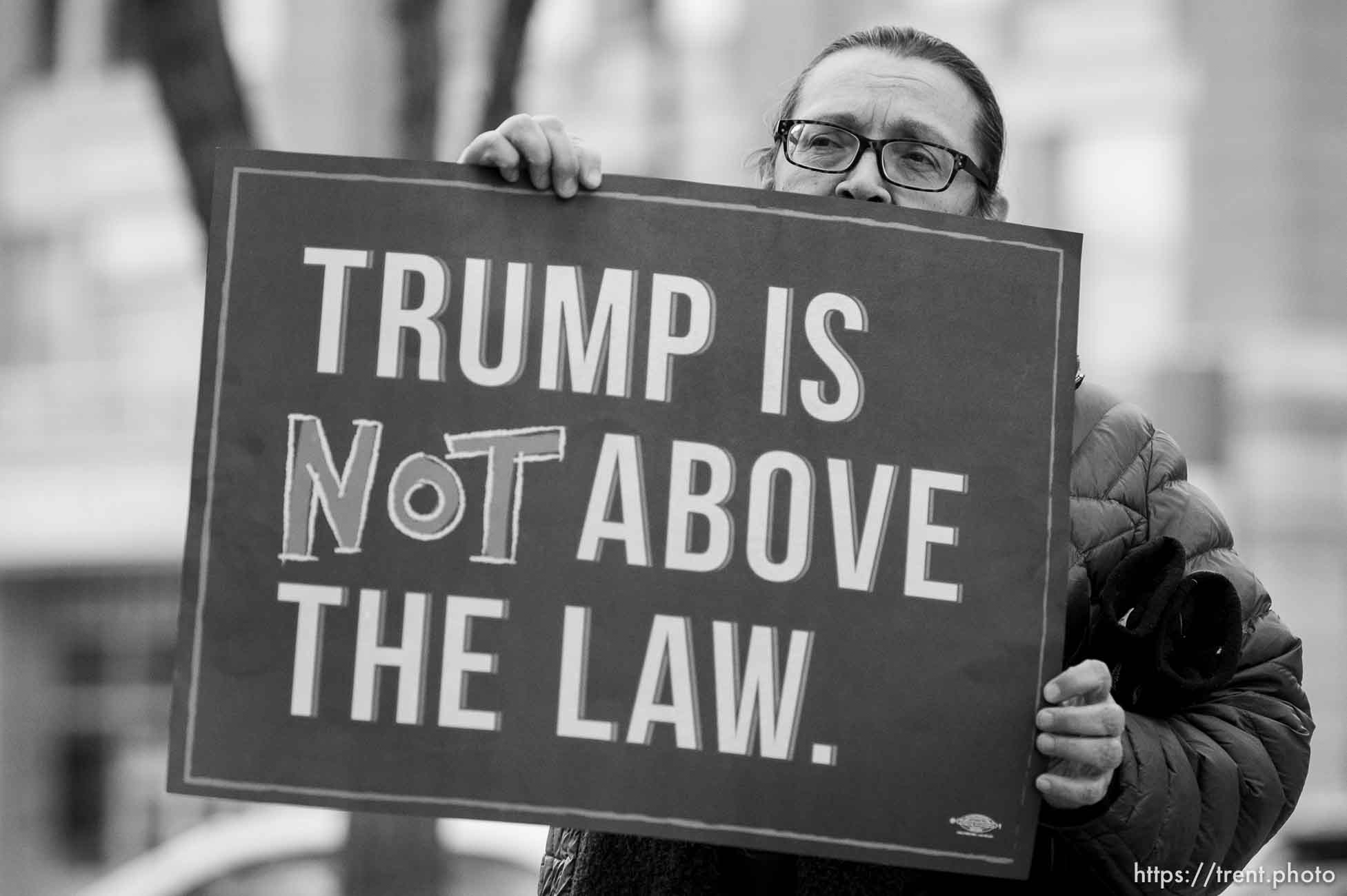 (Trent Nelson  |  The Salt Lake Tribune) Marcie Hank holds a sign as a coalition of progressive groups gathered Thursday outside the federal building in Salt Lake City on Thursday, Jan. 16, 2020 to push for a fair and impartial Senate impeachment hearing against President Donald Trump.