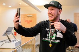 (Trent Nelson  |  The Salt Lake Tribune) Mario Enriquez, a patient, livestreams as Dragonfly Wellness becomes the first of Utah's 14 medical cannabis pharmacies to open for business in Salt Lake City on Monday, March 2, 2020.