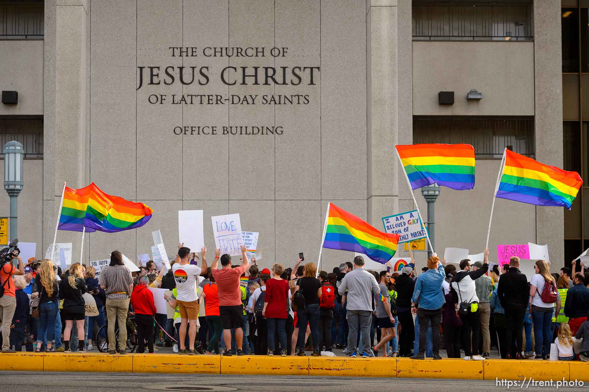 (Trent Nelson  |  The Salt Lake Tribune) Demonstrators at a rally about BYU's changing position on “romantic behavior” by same-sex couples gather in front of the headquarters of The Church of Jesus Christ of Latter-day Saints in Salt Lake City on Friday, March 6, 2020.