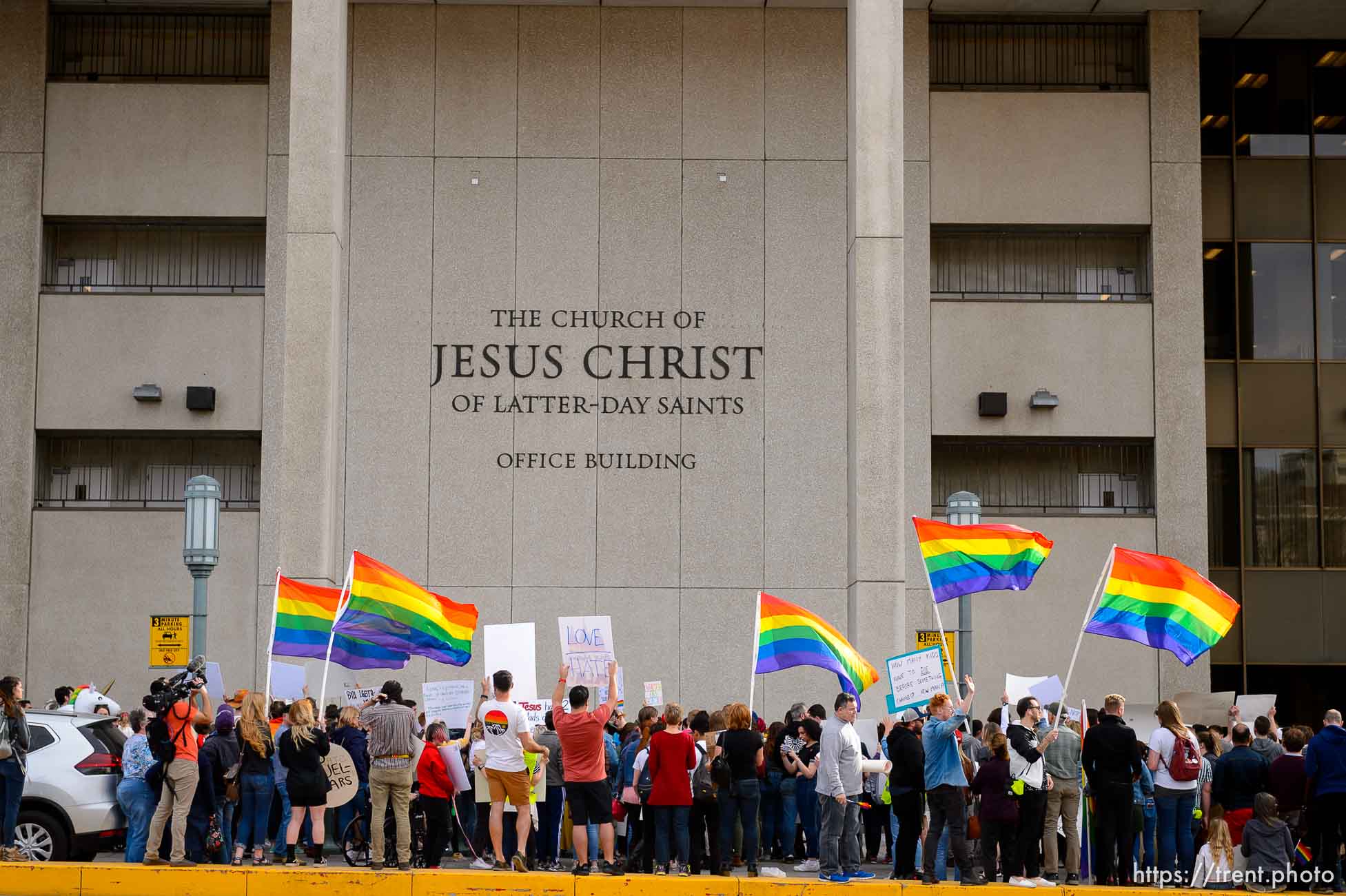 (Trent Nelson  |  The Salt Lake Tribune) Demonstrators at a rally about BYU's changing position on “romantic behavior” by same-sex couples gather in front of the headquarters of The Church of Jesus Christ of Latter-day Saints in Salt Lake City on Friday, March 6, 2020.