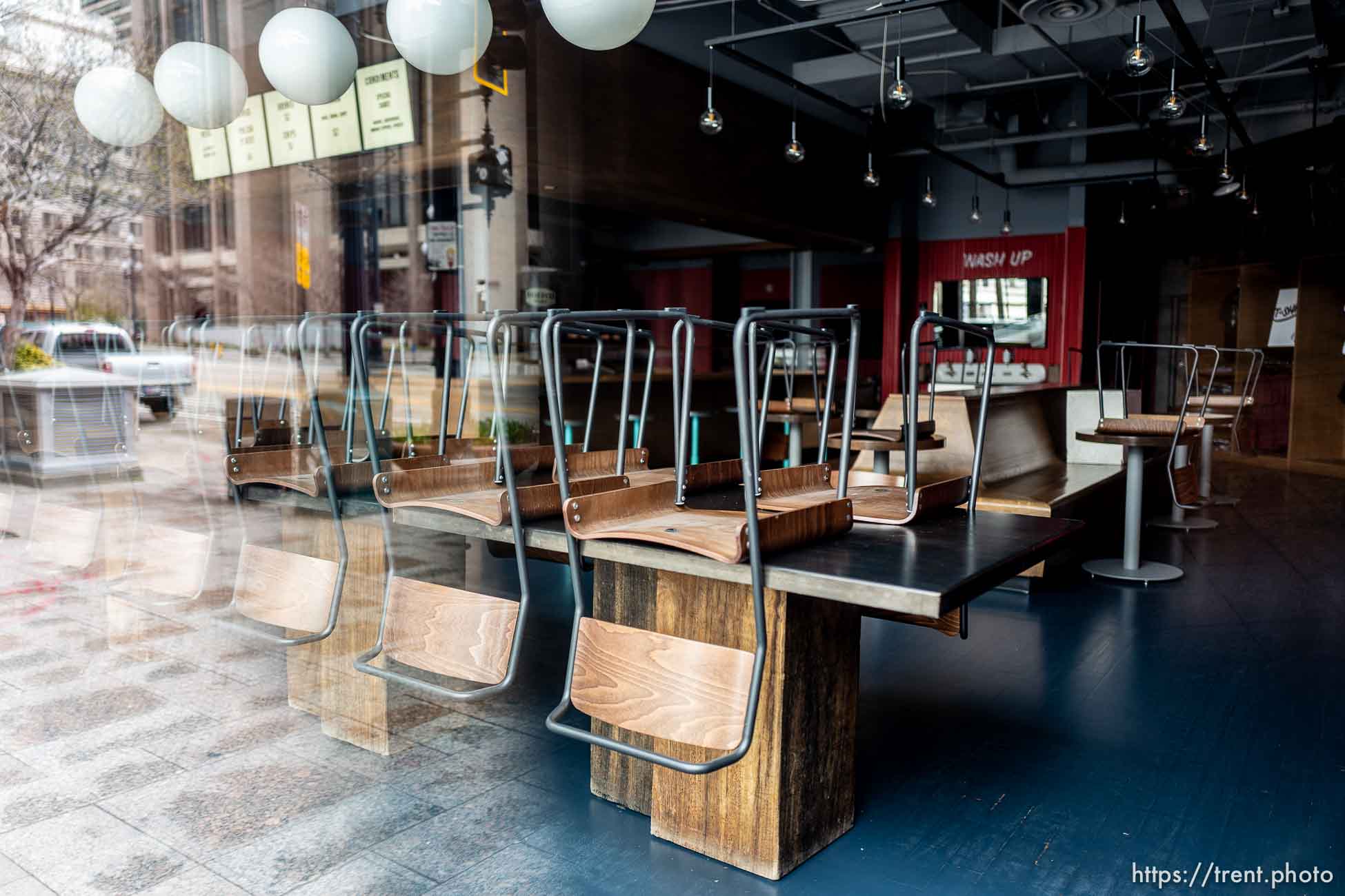 (Trent Nelson  |  The Salt Lake Tribune) Stacked chairs in the closed J. Dawgs Salt Lake City location on Monday, March 23, 2020.