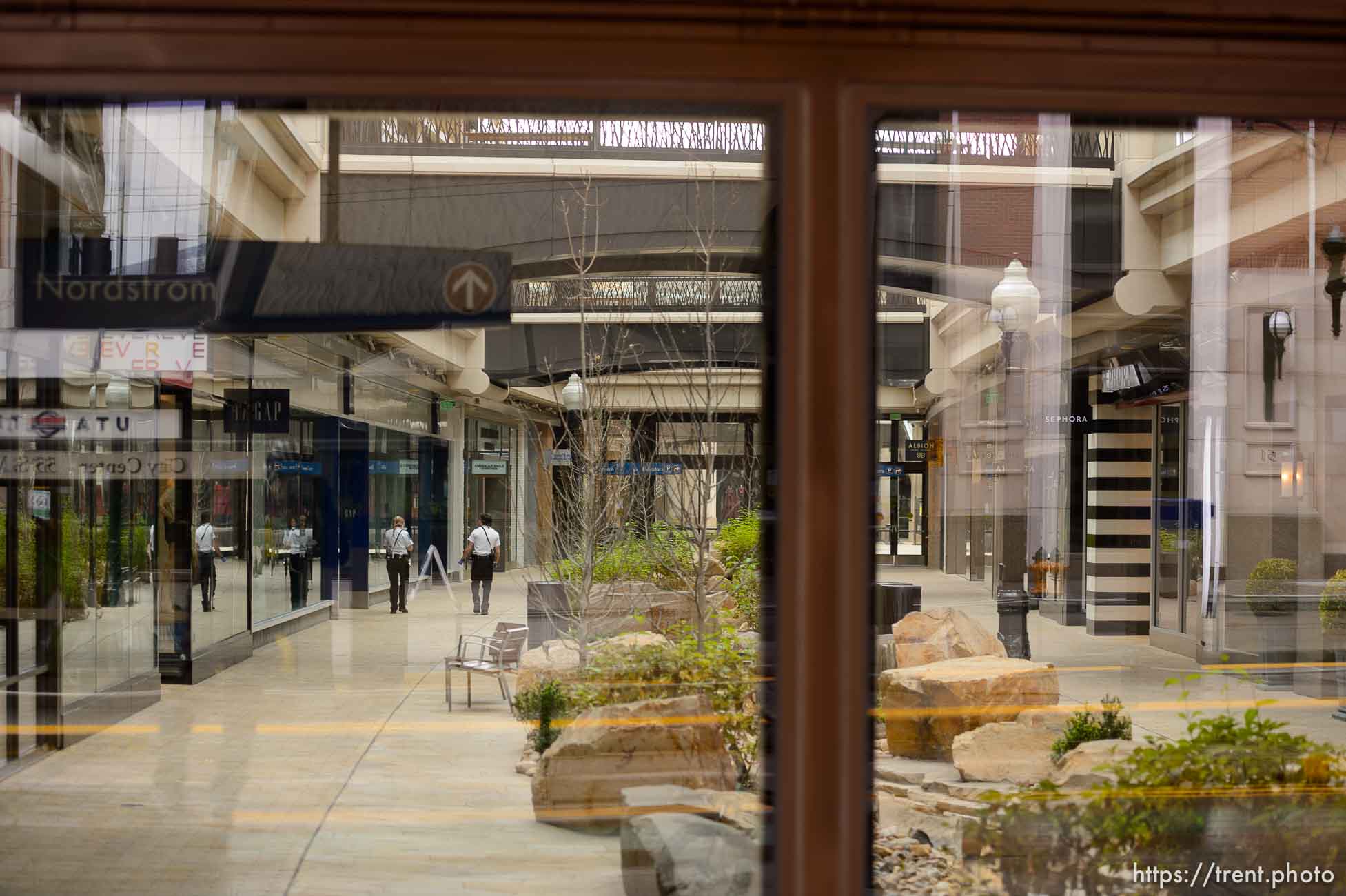 (Trent Nelson  |  The Salt Lake Tribune) A pair of security guards walk through the closed City Creek Mall in Salt Lake City on Monday, March 23, 2020.