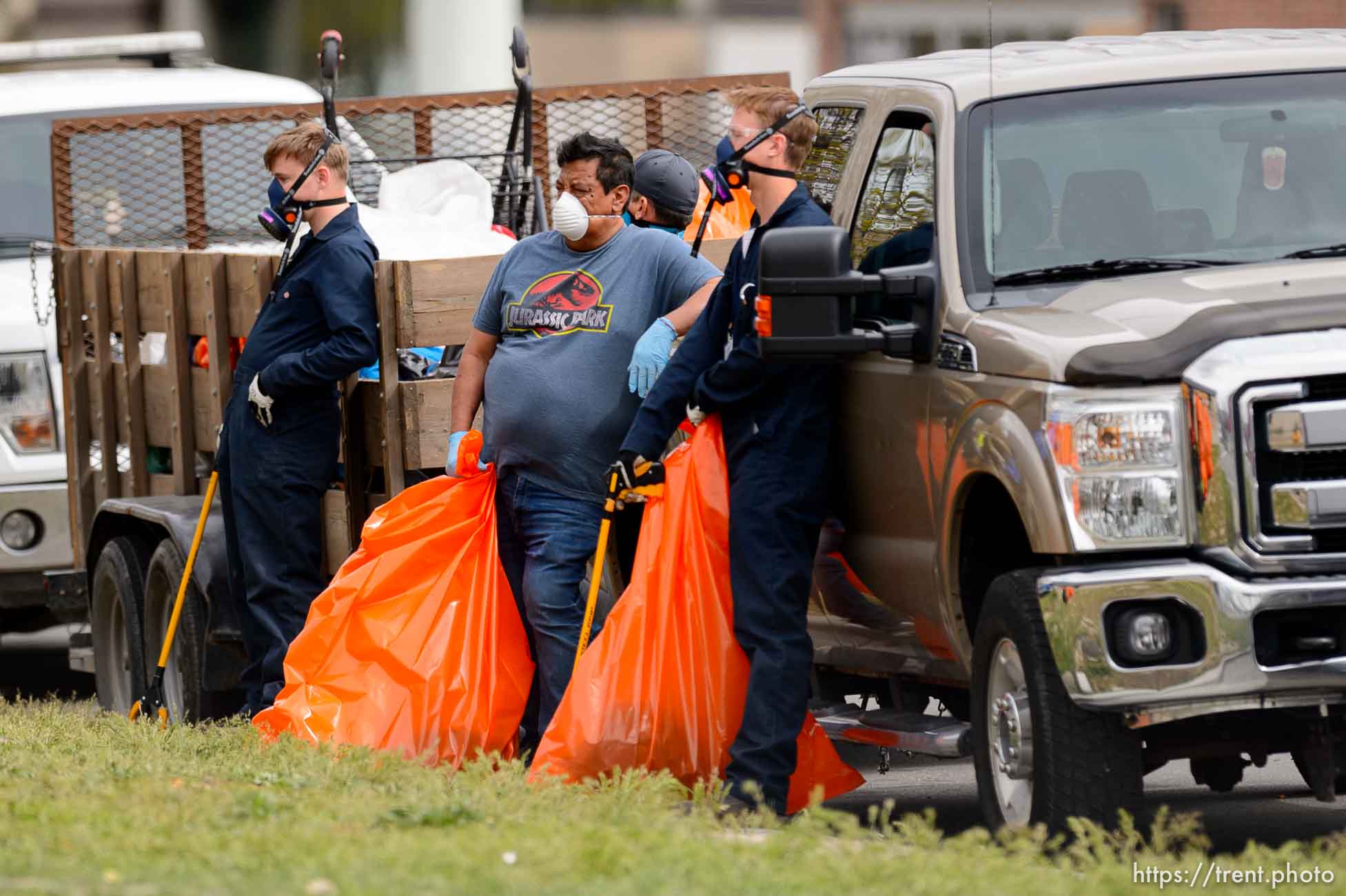 (Trent Nelson  |  The Salt Lake Tribune) Salt Lake City police and Salt Lake County Health Department personnel remove an encampment at 700 South State Street in Salt Lake City on Saturday, April 11, 2020.