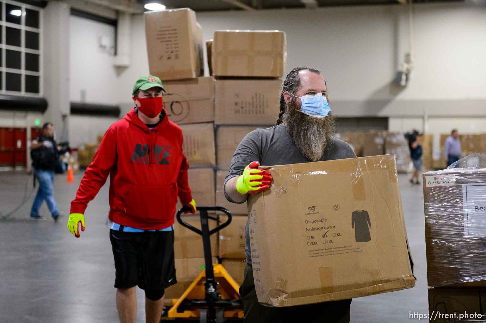 (Trent Nelson  |  The Salt Lake Tribune) Workers organize supplies at the Receiving, Staging and Shipping Center at the Salt Palace Convention Center in Salt Lake City on Friday, May 8, 2020. The center serves as a central location for personal protective equipment received by the State of Utah and sent to hospitals, local health departments and emergency managers.