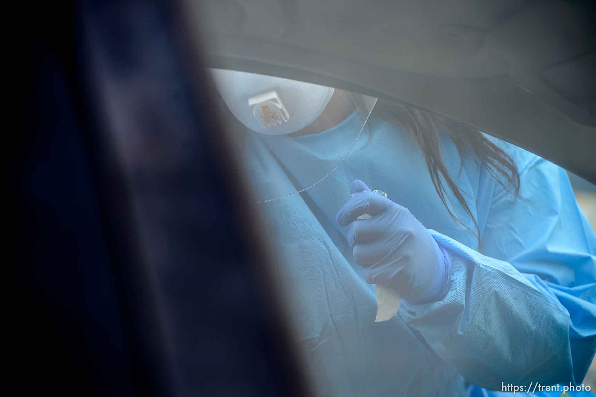 (Trent Nelson  |  The Salt Lake Tribune) Jessica Picaso tests a patient for COVID-19 during an event sponsored by Comunidades Unidas at Mid-Valley Health Clinic in Midvale on Wednesday, May 20, 2020. The event was also sponsored by the Utah Partners for Health, Mid-Valley Health Clinic and the Utah Department of Health.