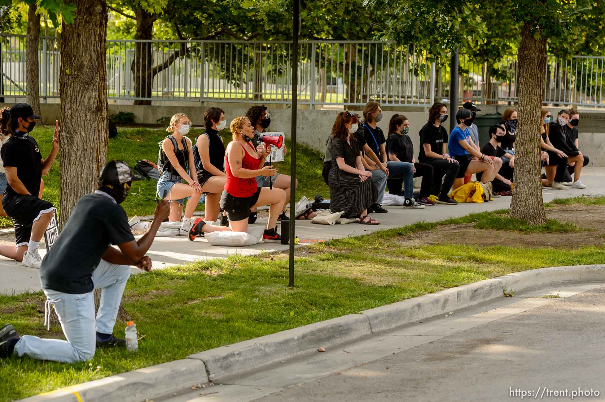 (Trent Nelson  |  The Salt Lake Tribune) A small group of Black Lives Matter activists led by Victoria Crosby kneel with National Guard and Salt Lake Police in front of the Public Safety Building in Salt Lake City on Tuesday, June 2, 2020.