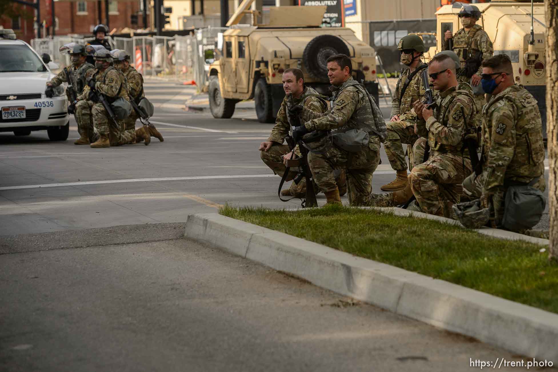 (Trent Nelson  |  The Salt Lake Tribune) A small group of Black Lives Matter activists led by Victoria Crosby kneel with National Guard and Salt Lake Police in front of the Public Safety Building in Salt Lake City on Tuesday, June 2, 2020.