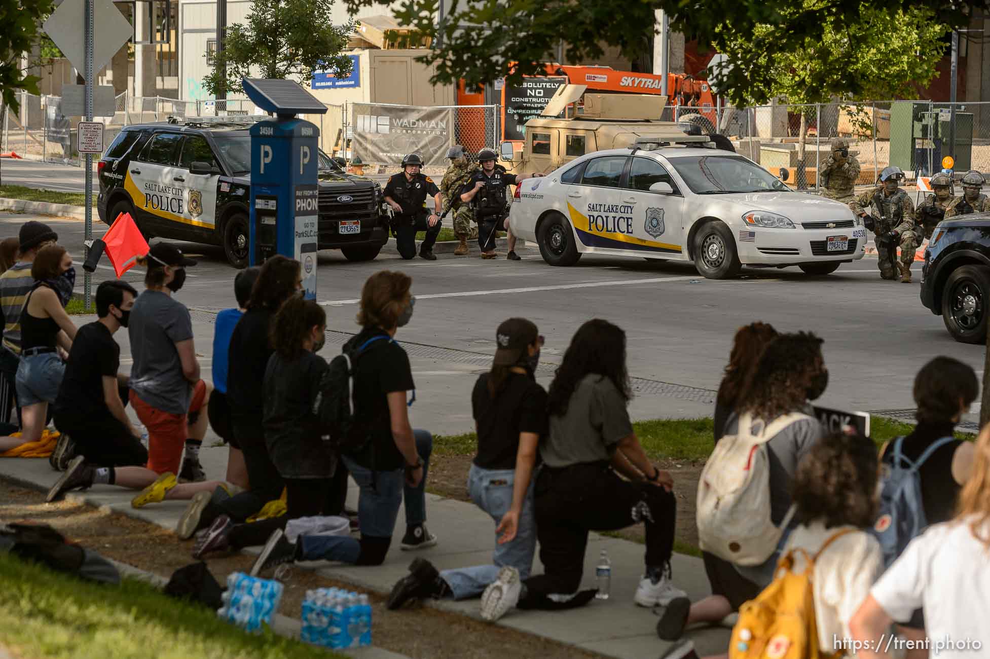 (Trent Nelson  |  The Salt Lake Tribune) A small group of Black Lives Matter activists led by Victoria Crosby kneel with National Guard and Salt Lake Police in front of the Public Safety Building in Salt Lake City on Tuesday, June 2, 2020.