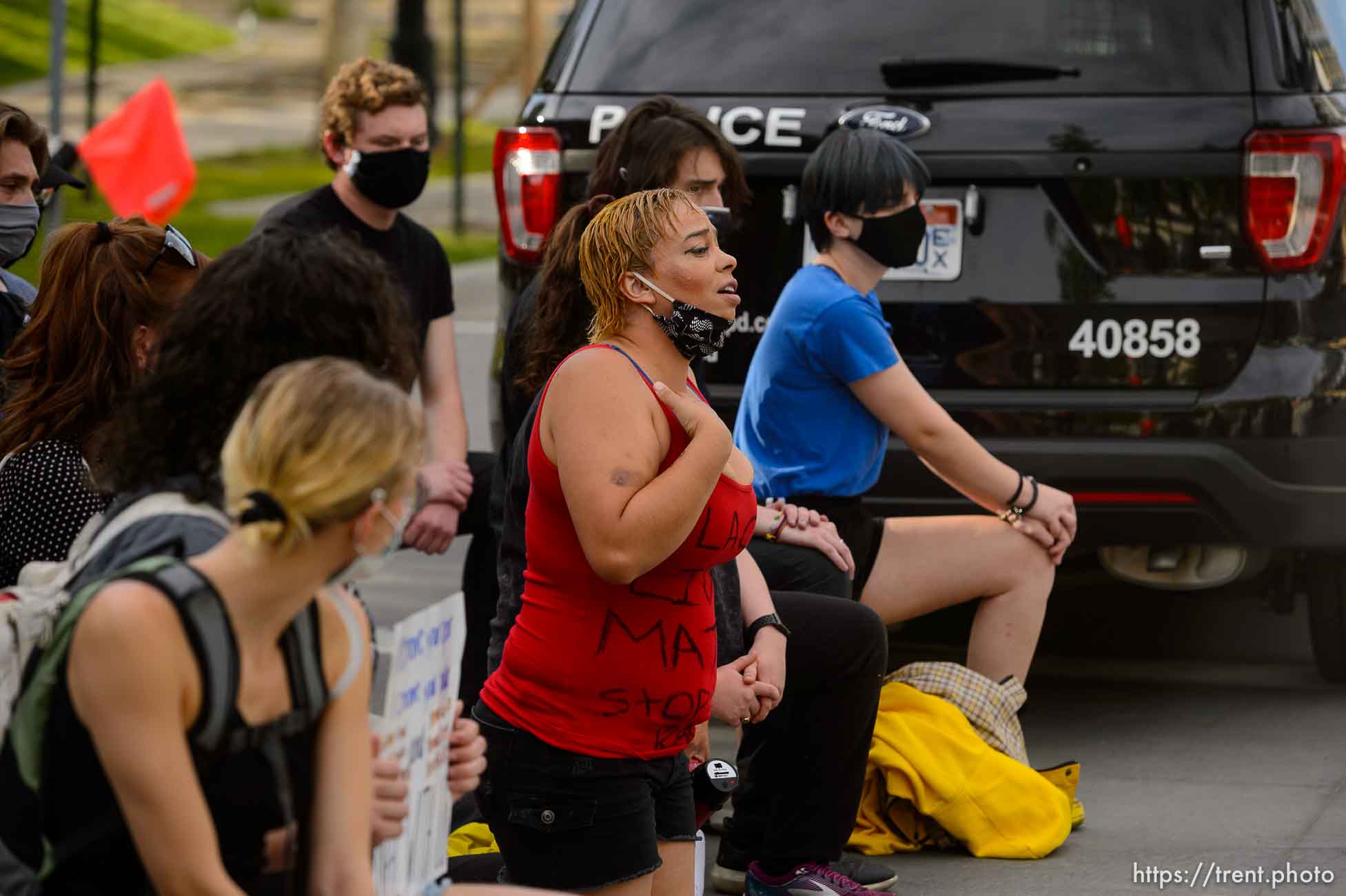 (Trent Nelson  |  The Salt Lake Tribune) A small group of Black Lives Matter activists led by Victoria Crosby kneel with National Guard and Salt Lake Police in front of the Public Safety Building in Salt Lake City on Tuesday, June 2, 2020.