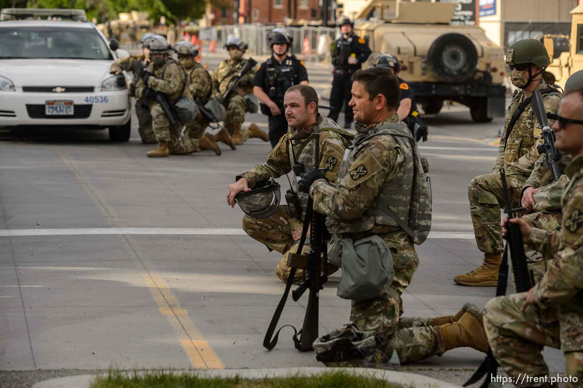 (Trent Nelson  |  The Salt Lake Tribune) A small group of Black Lives Matter activists led by Victoria Crosby kneel with National Guard and Salt Lake Police in front of the Public Safety Building in Salt Lake City on Tuesday, June 2, 2020.