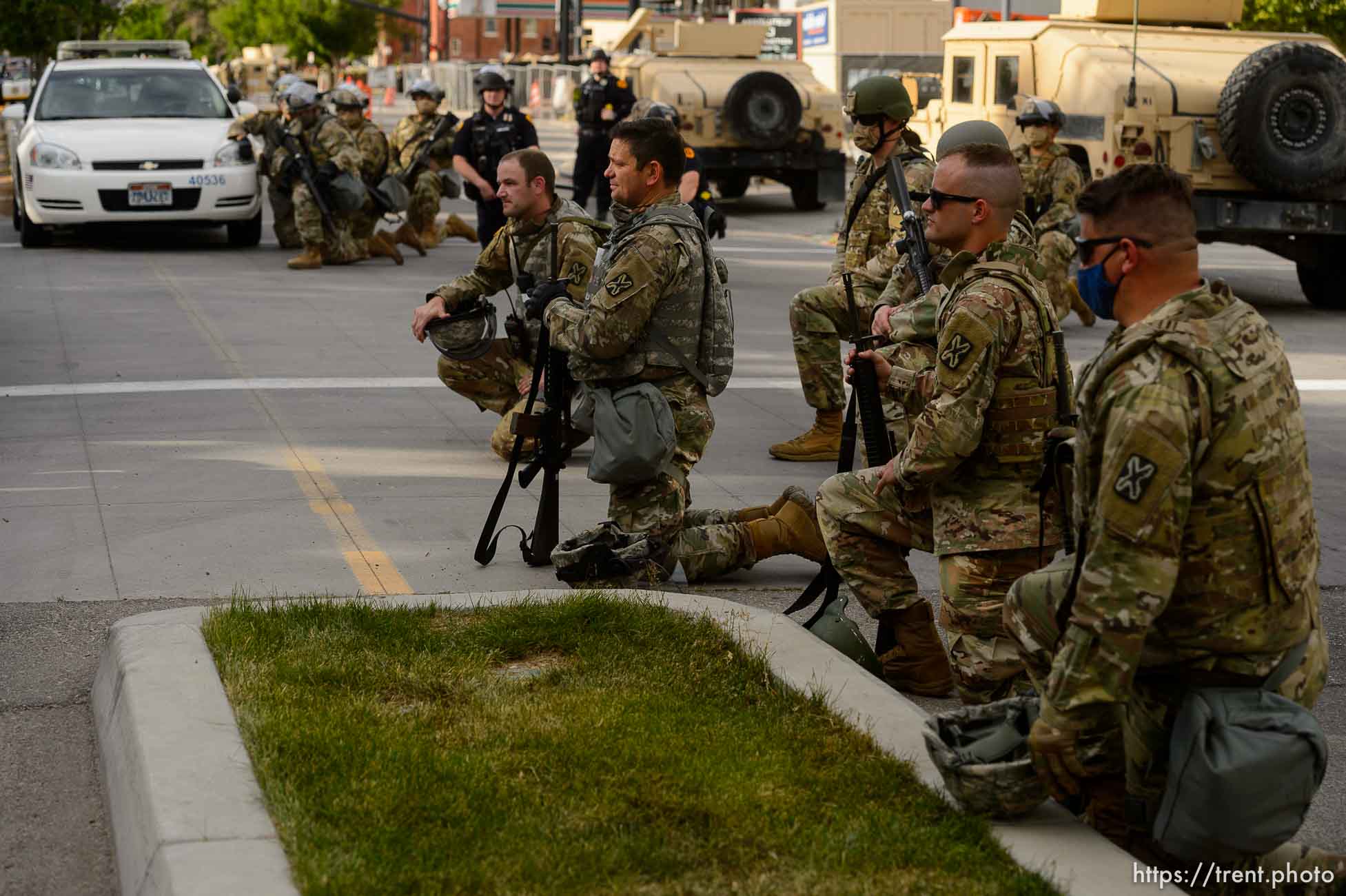 (Trent Nelson  |  The Salt Lake Tribune) A small group of Black Lives Matter activists led by Victoria Crosby kneel with National Guard and Salt Lake Police in front of the Public Safety Building in Salt Lake City on Tuesday, June 2, 2020.