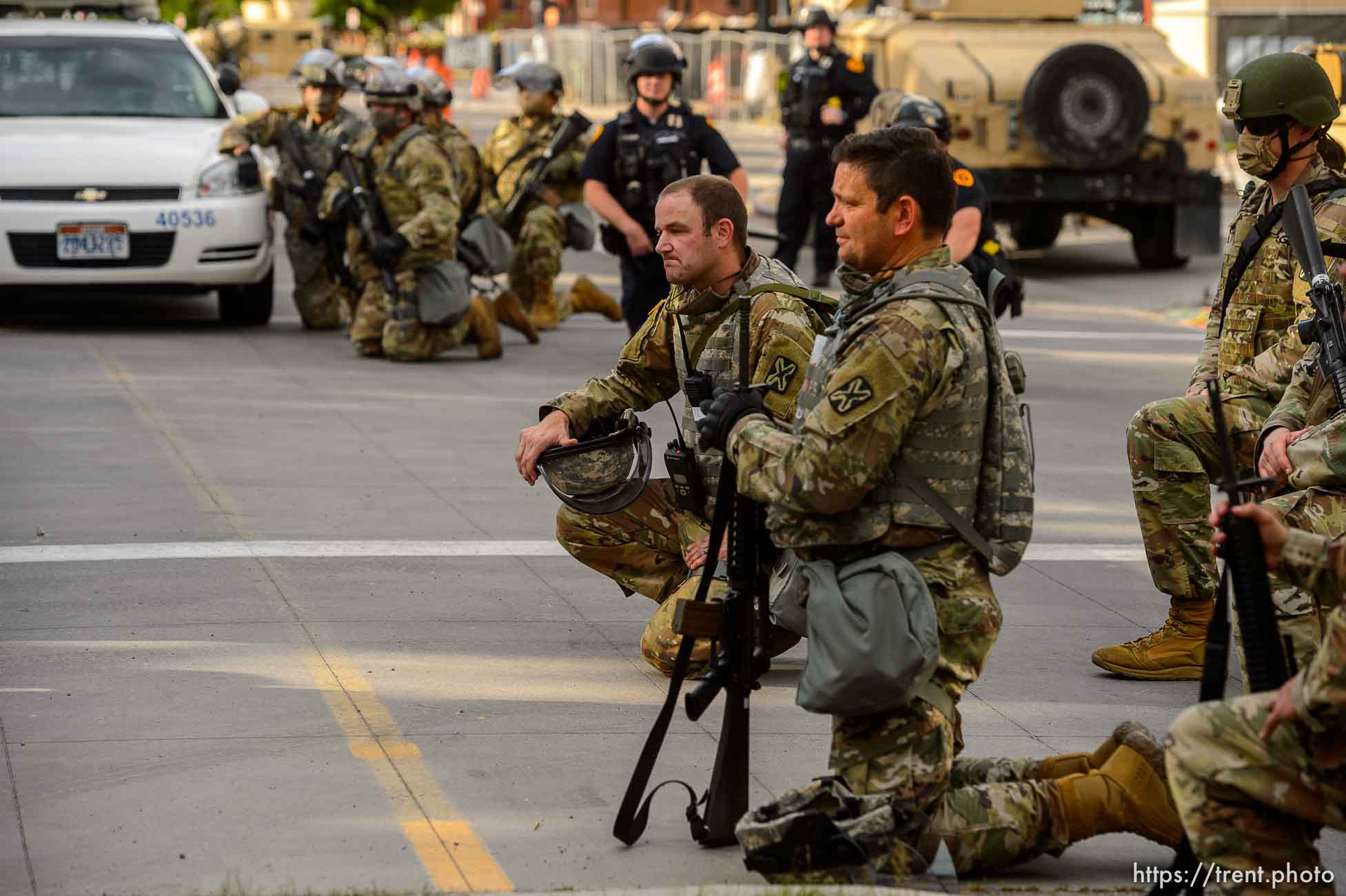 (Trent Nelson  |  The Salt Lake Tribune) A small group of Black Lives Matter activists led by Victoria Crosby kneel with National Guard and Salt Lake Police in front of the Public Safety Building in Salt Lake City on Tuesday, June 2, 2020.