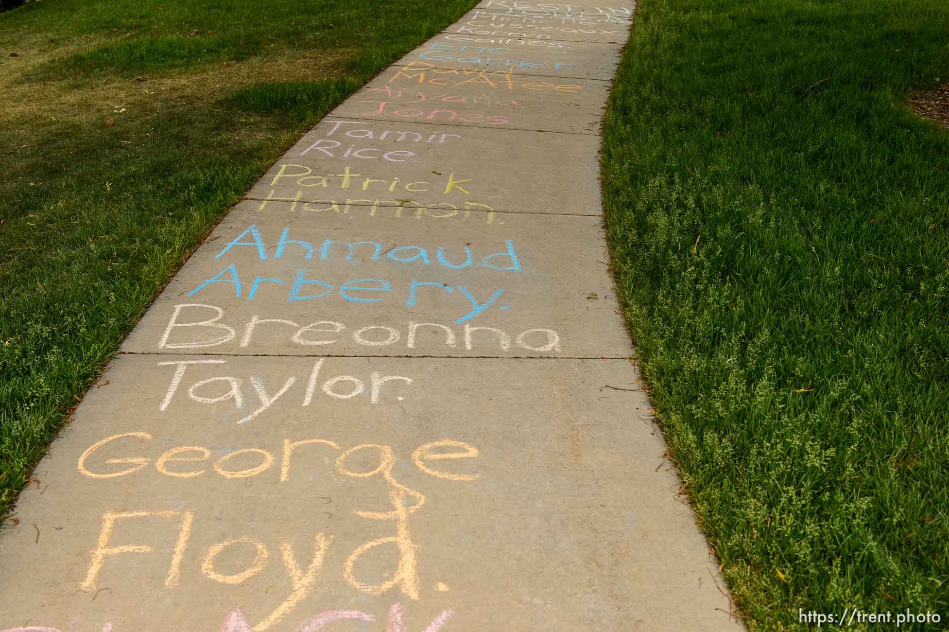 (Trent Nelson  |  The Salt Lake Tribune) Names written on the sidewalk as protesters rally against police brutality rally at the State Capitol in Salt Lake City on Friday, June 5, 2020.