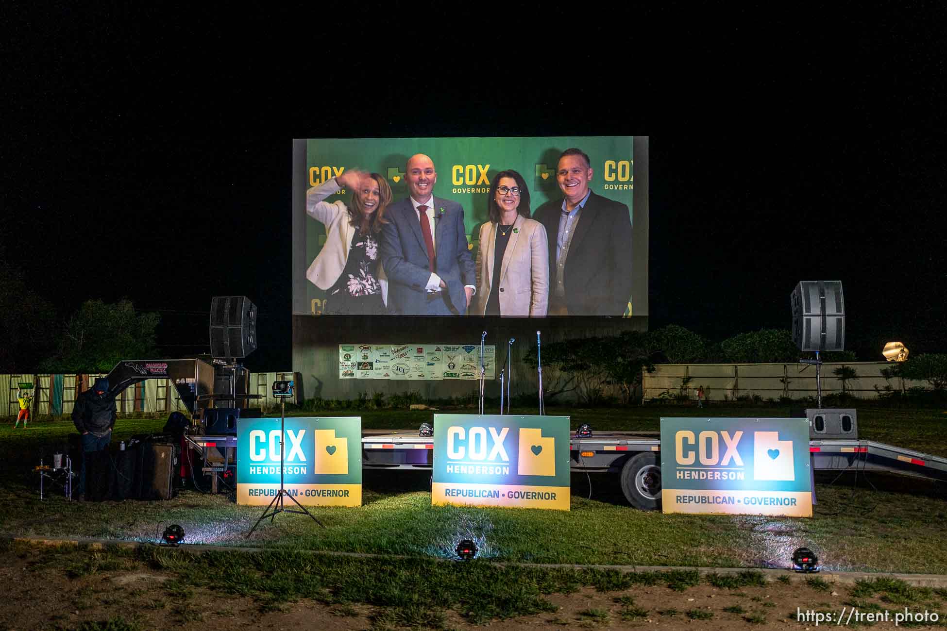 (Trent Nelson  |  The Salt Lake Tribune) Utah Republican gubernatorial candidate Lt. Gov. Spencer Cox appears on the screen of the Basin Drive In Theater at an election night event in Mount Pleasant on Tuesday, June 30, 2020. From left, Abby Cox, Spencer Cox, Sen. Deidre Henderson, R-Spanish Fork, and Dave Henderson.