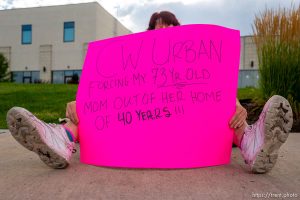 (Trent Nelson  |  The Salt Lake Tribune) Rebecca Hernon protests possible evictions in front of the offices of C.W. Land in Centerville on Monday, July 13, 2020.