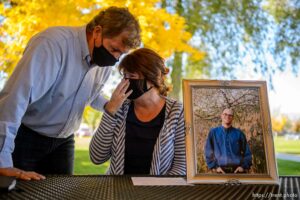 (Trent Nelson  |  The Salt Lake Tribune) 
Rob Whittle comforts Annie Esposito before a news conference in Riverton on Wednesday, Oct. 21, 2020. The two detailed the loss of their son Jason who was killed by police last year in 2018 and announced the filing of a lawsuit saying the Unified police officer should have used less than deadly force.