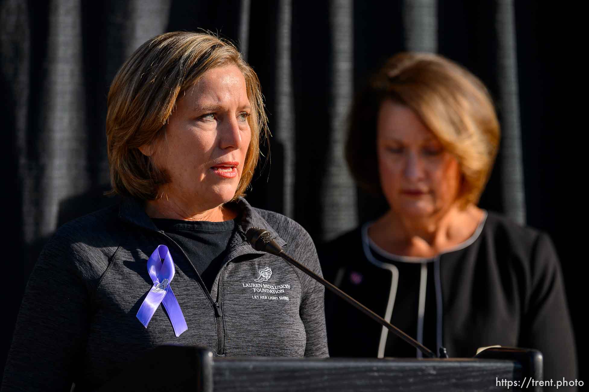 (Trent Nelson  |  The Salt Lake Tribune) Jill McCluskey speaks as the family of Lauren McCluskey announces a settlement of their lawsuit against the University of Utah, in Salt Lake City on Thursday, Oct. 22, 2020. University of Utah President Ruth Watkins is at right.