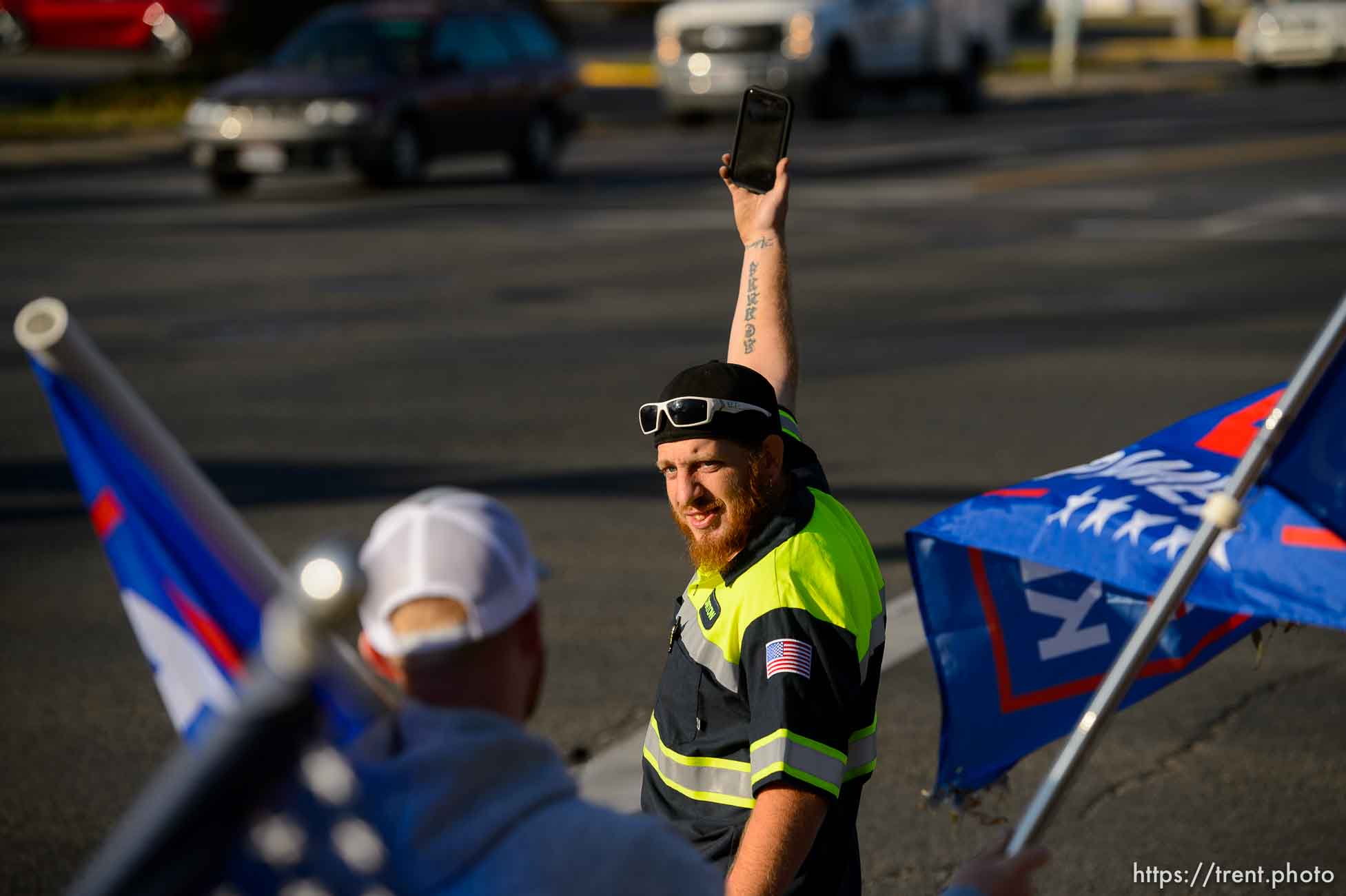 (Trent Nelson  |  The Salt Lake Tribune) A group of Trump supporters wave flags on the corner of 2100 S State Street in Salt Lake City on Tuesday, Nov. 3, 2020.