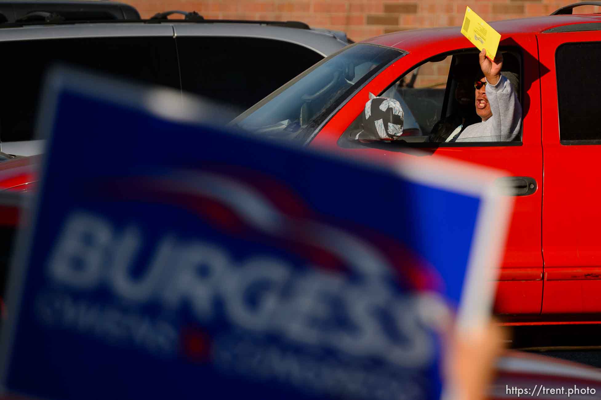 (Trent Nelson  |  The Salt Lake Tribune) A group of Trump supporters wave flags on the corner of 2100 S State Street in Salt Lake City on Tuesday, Nov. 3, 2020.