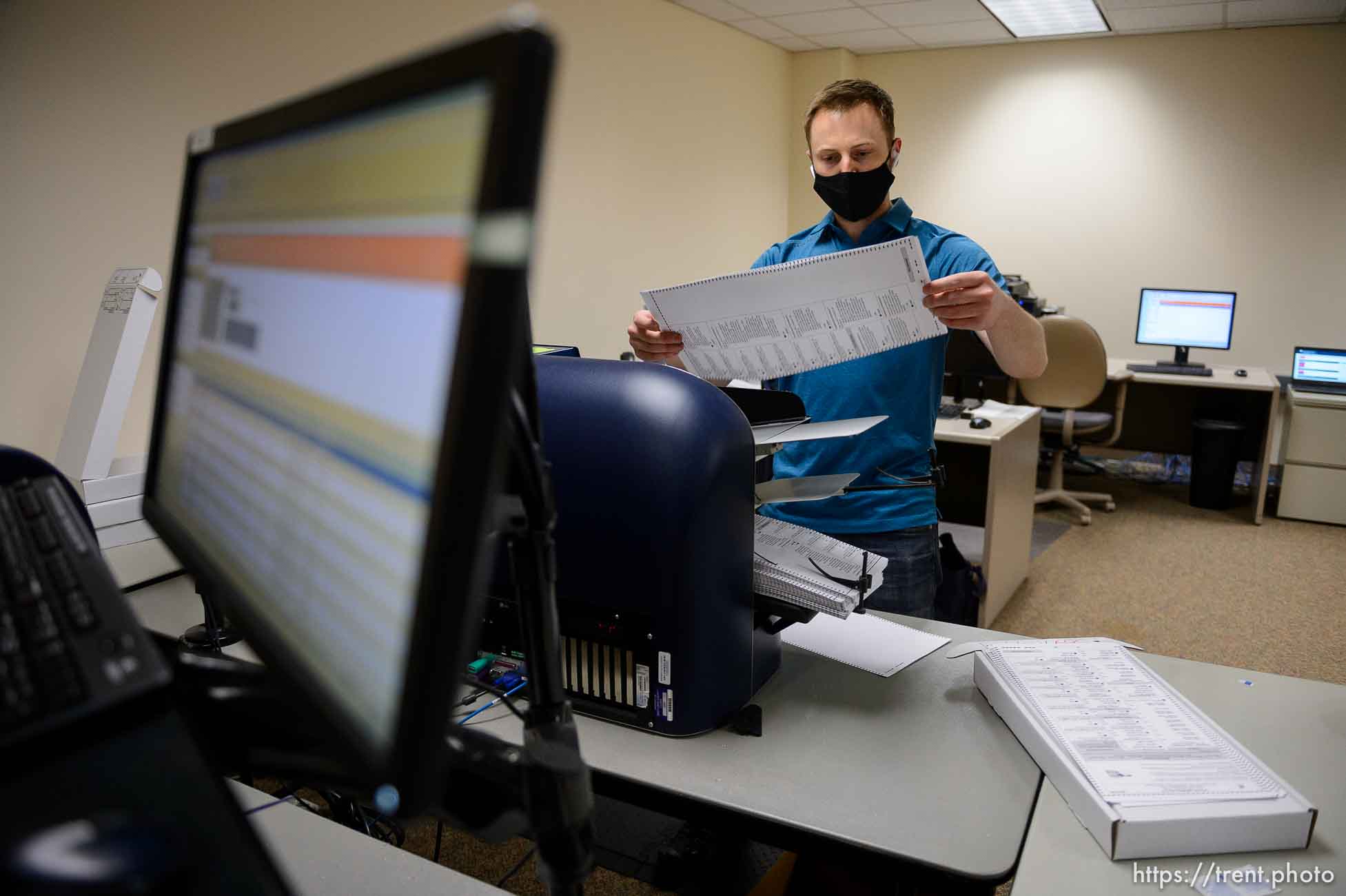 (Trent Nelson  |  The Salt Lake Tribune) Stephen Moore scans ballots at the Salt Lake County offices in Salt Lake City on Wednesday, Nov. 4, 2020.