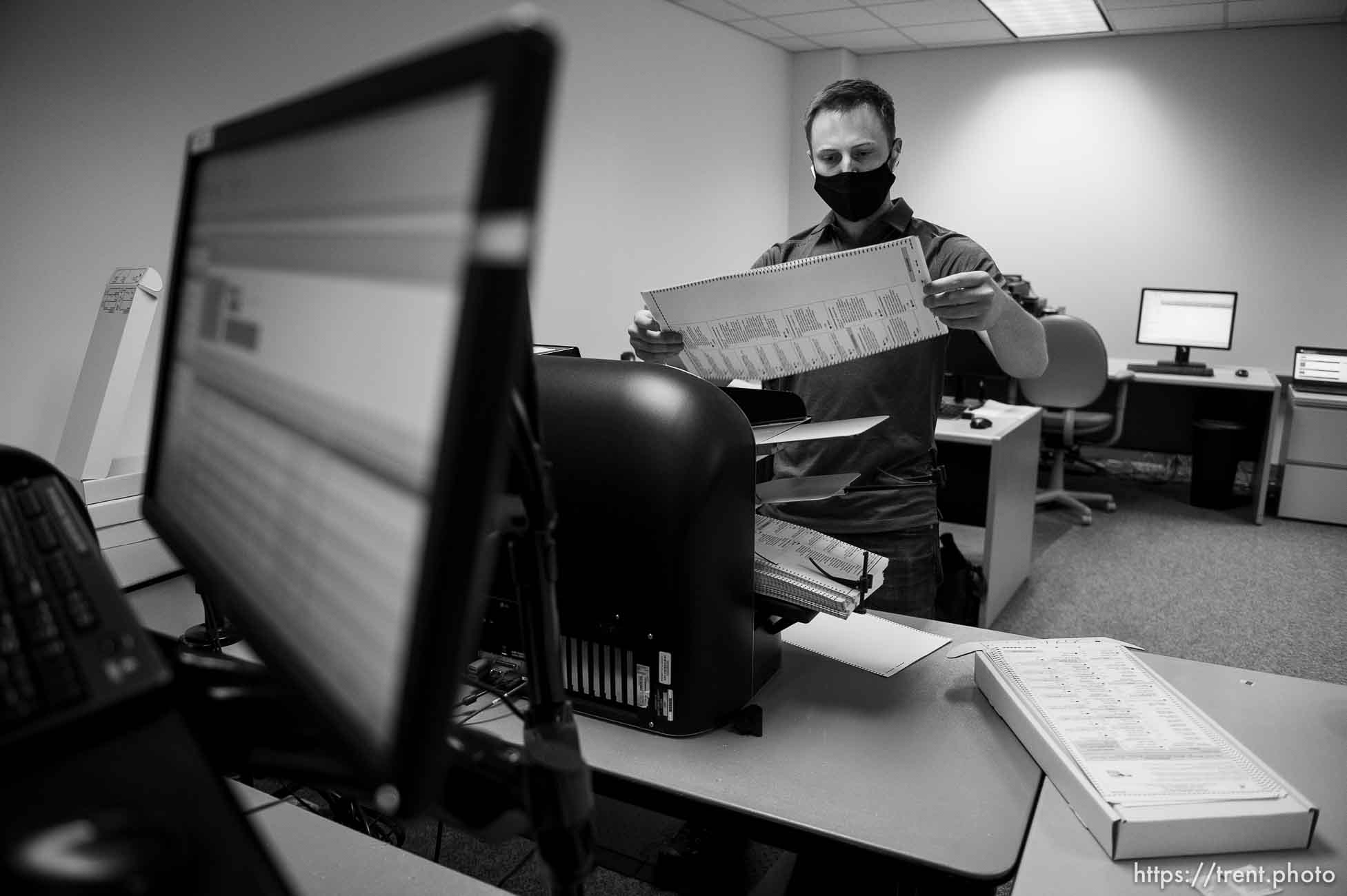 (Trent Nelson  |  The Salt Lake Tribune) Stephen Moore scans ballots at the Salt Lake County offices in Salt Lake City on Wednesday, Nov. 4, 2020.