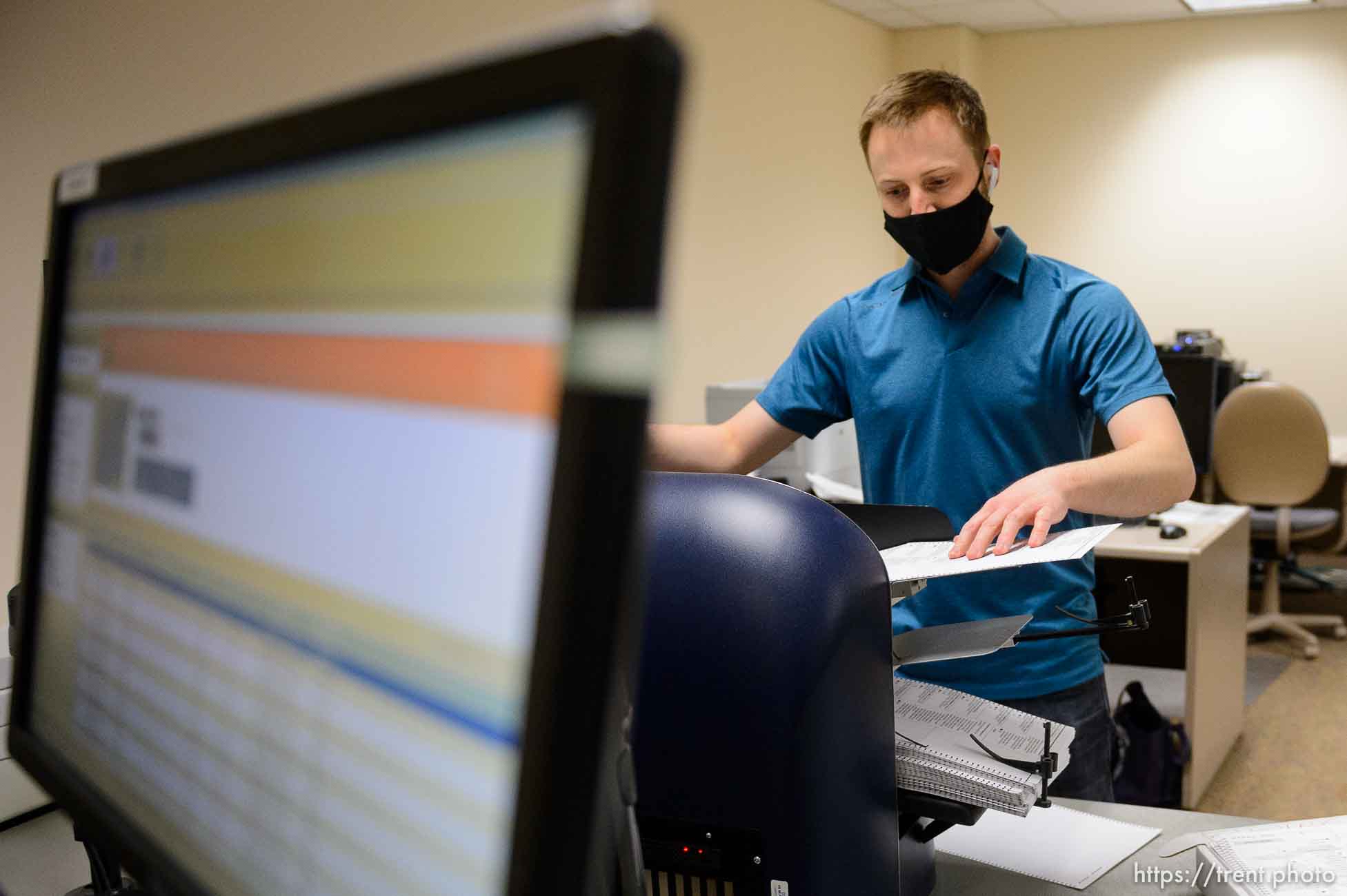 (Trent Nelson  |  The Salt Lake Tribune) Stephen Moore scans ballots at the Salt Lake County offices in Salt Lake City on Wednesday, Nov. 4, 2020.