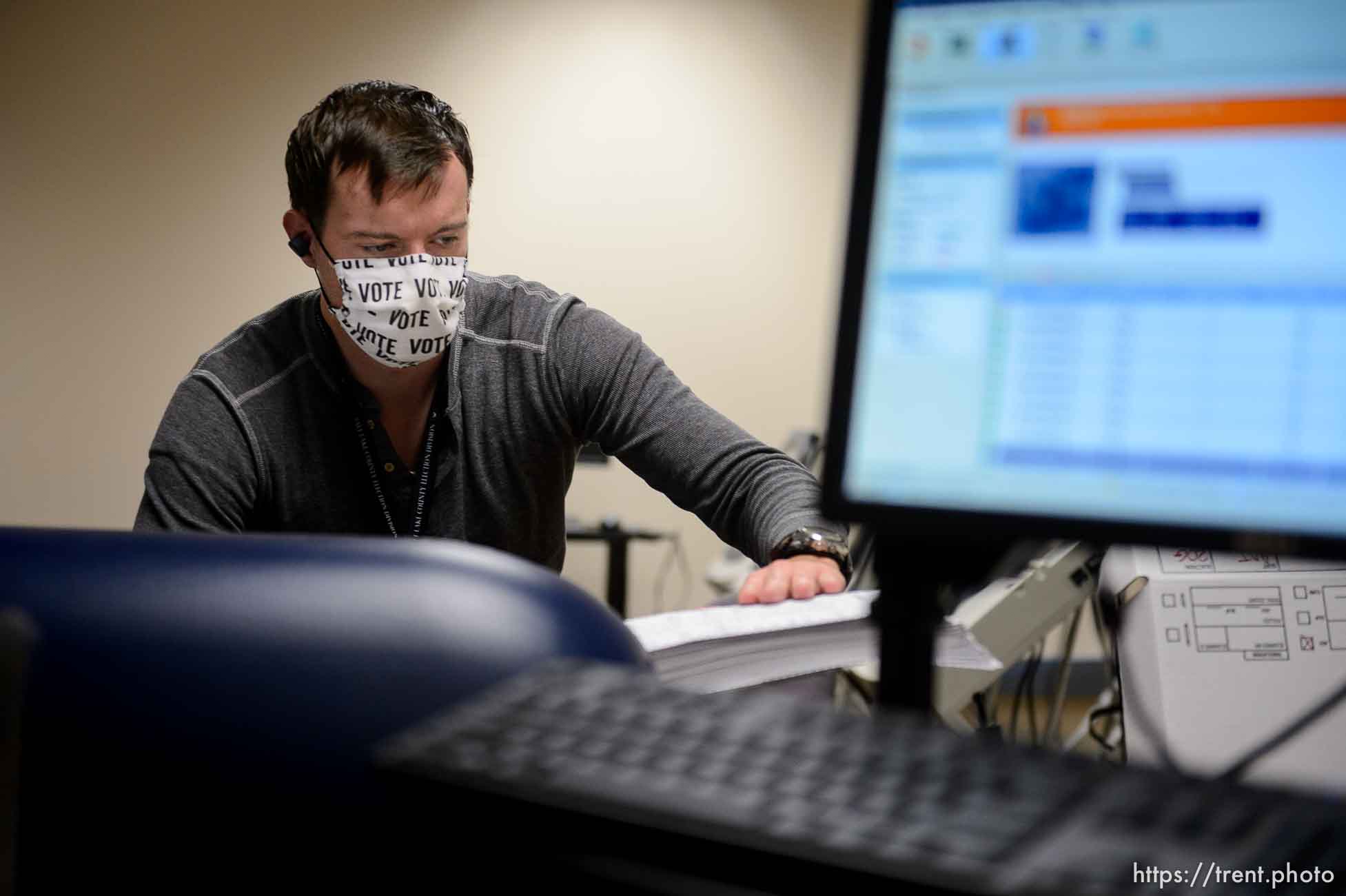 (Trent Nelson  |  The Salt Lake Tribune) Sam Stamos scans ballots at the Salt Lake County offices in Salt Lake City on Wednesday, Nov. 4, 2020.