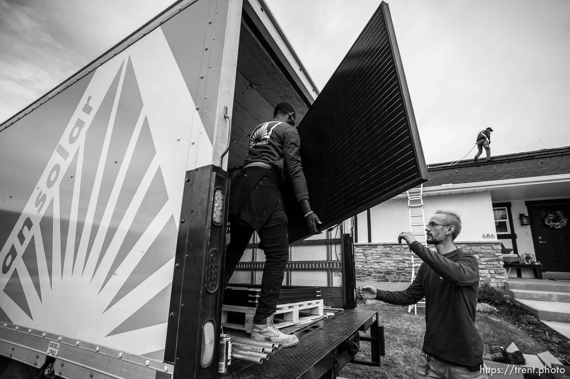 (Trent Nelson  |  The Salt Lake Tribune) A crew from Elan Solar installs solar panels on a Santaquin home on Friday, Nov. 6, 2020. From left, George Clement, Eric Larkin, and LJ Jenkins.