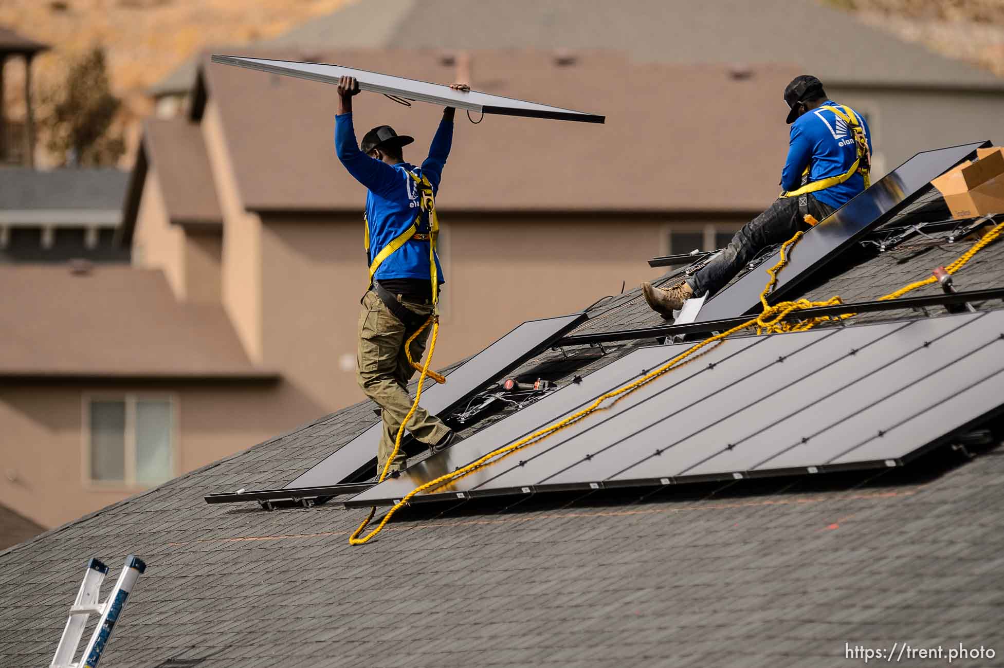 (Trent Nelson  |  The Salt Lake Tribune) LJ Jenkins and RB Biel, workers with Elan Solar, install solar panels on a Santaquin home on Friday, Nov. 6, 2020.