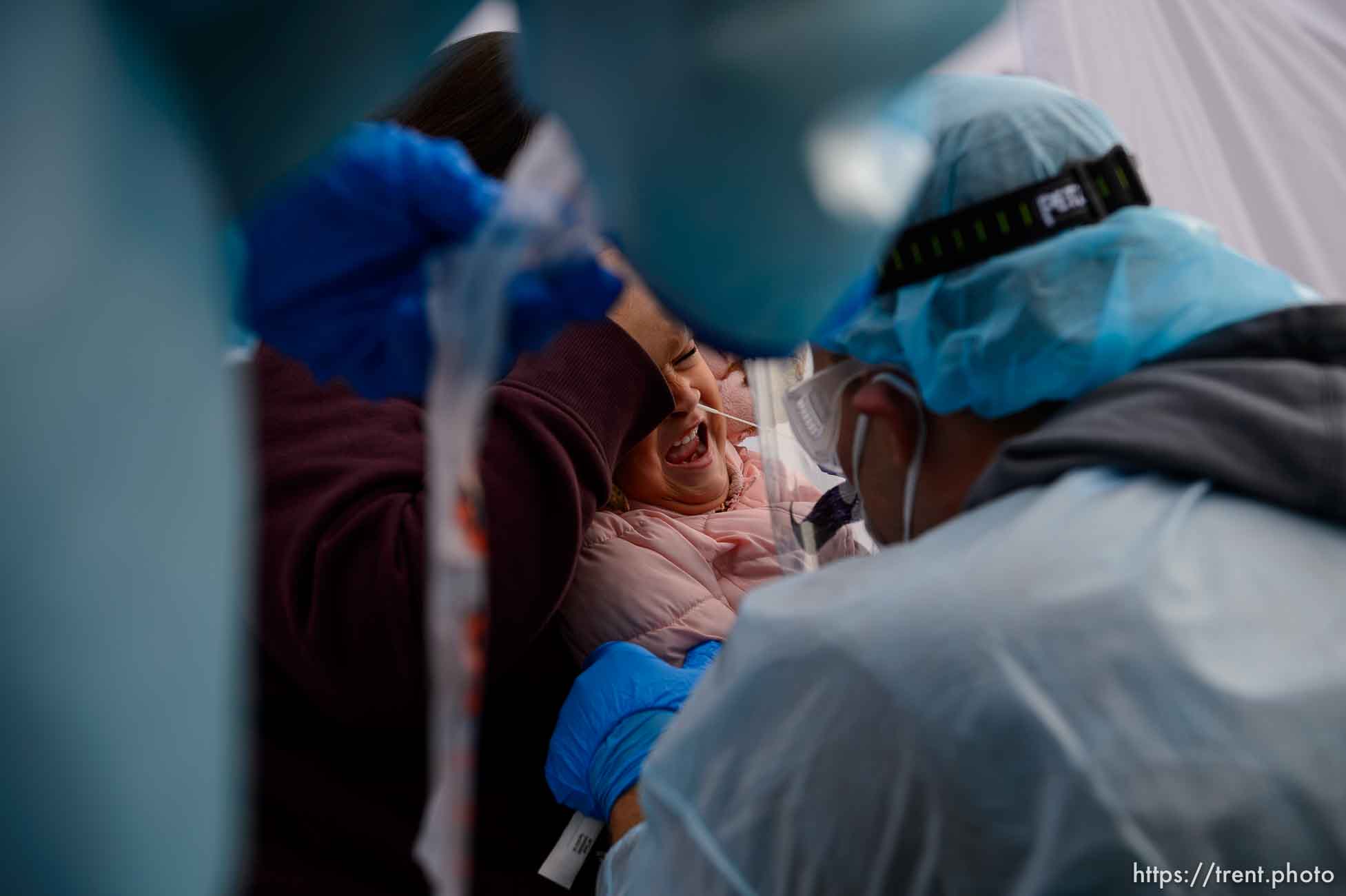 (Trent Nelson  |  The Salt Lake Tribune) Kim Tapia holds her granddaughter Amariah Lucero as she's tested at the Utah National Guard’s mobile testing site for COVID-19 in Salt Lake City on Tuesday, Nov. 10, 2020.