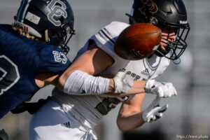 (Trent Nelson  |  The Salt Lake Tribune) Corner Canyon's Scott Iverson strips the ball from Lone Peak's Weston Covey as he nears the goal line during the 6A state football championship game at Cedar Valley High School in Eagle Mountain on Friday, Nov. 20, 2020.