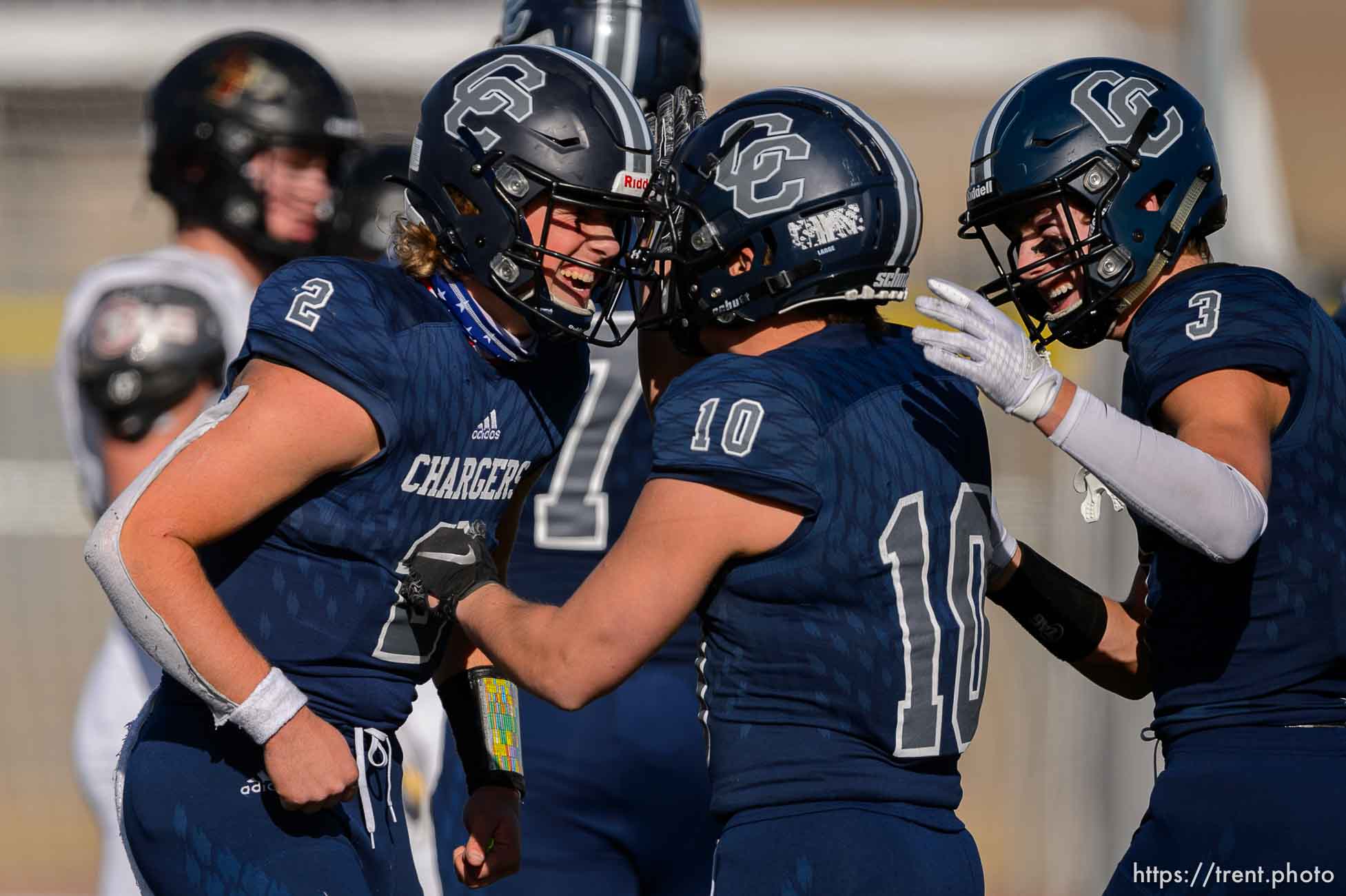 (Trent Nelson  |  The Salt Lake Tribune) Corner Canyon's Jaxson Dart celebrates with Austin Bell (10) and Cody Hagen (3) at the end of the 6A state football championship game against Lone Peak at Cedar Valley High School in Eagle Mountain on Friday, Nov. 20, 2020.