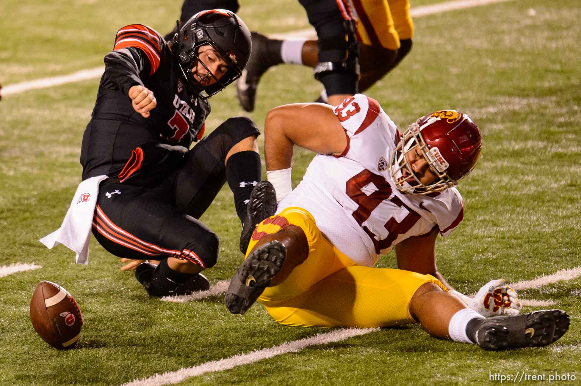 (Trent Nelson  |  The Salt Lake Tribune) Utah Utes quarterback Cameron Rising (7) tries to recover the ball he fumbled as he's hit by USC Trojans defensive lineman Marlon Tuipulotu (93), as the Utah Utes host the USC Trojans, NCAA football at Rice-Eccles Stadium in Salt Lake City on Saturday, Nov. 21, 2020.