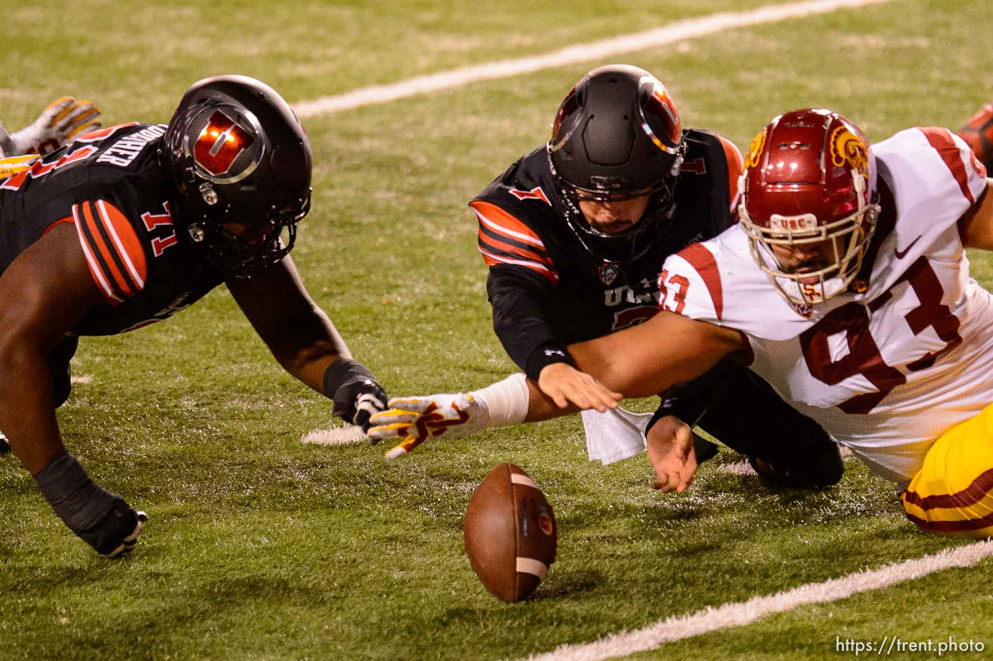 (Trent Nelson  |  The Salt Lake Tribune) Utah Utes quarterback Cameron Rising (7) tries to recover the ball he fumbled as he's hit by USC Trojans defensive lineman Marlon Tuipulotu (93), as the Utah Utes host the USC Trojans, NCAA football at Rice-Eccles Stadium in Salt Lake City on Saturday, Nov. 21, 2020.