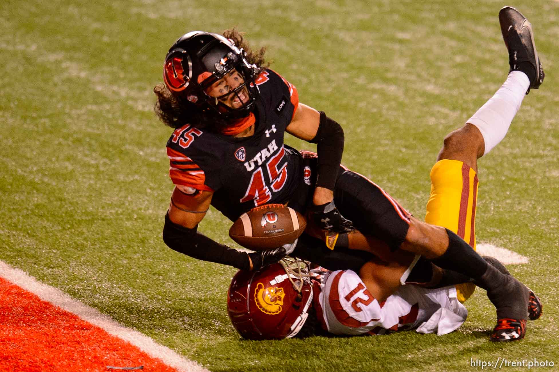 (Trent Nelson  |  The Salt Lake Tribune) Utah Utes wide receiver Samson Nacua (45) scores a touchdown, with USC Trojans safety Isaiah Pola-Mao (21) defending, as the Utah Utes host the USC Trojans, NCAA football at Rice-Eccles Stadium in Salt Lake City on Saturday, Nov. 21, 2020.