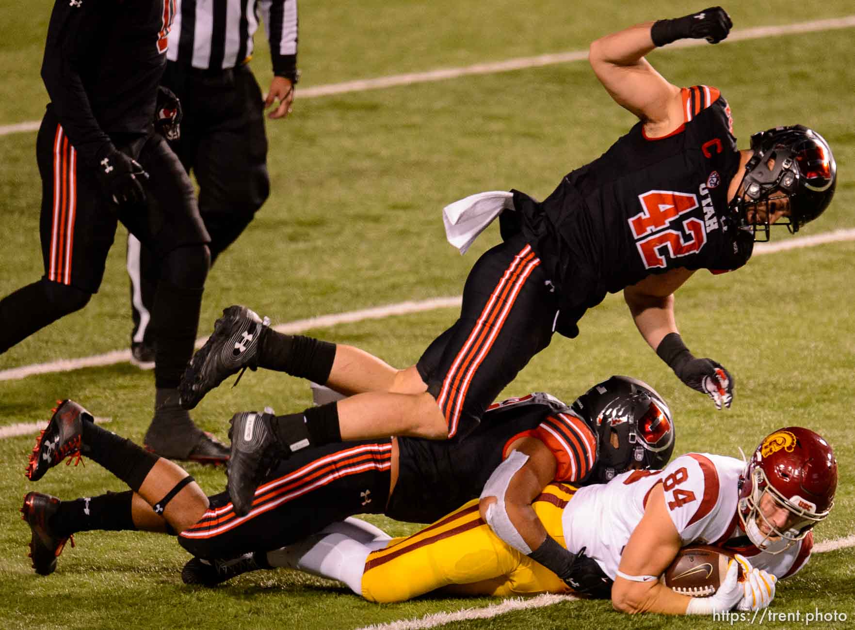 (Trent Nelson  |  The Salt Lake Tribune) Utah Utes defensive end Mika Tafua (42) flies over USC Trojans tight end Erik Krommenhoek (84), as the Utah Utes host the USC Trojans, NCAA football at Rice-Eccles Stadium in Salt Lake City on Saturday, Nov. 21, 2020.