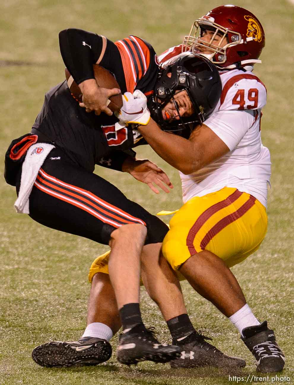 (Trent Nelson  |  The Salt Lake Tribune) USC Trojans defensive lineman Tuli Tuipulotu (49) sacks Utah Utes quarterback Jake Bentley (8), as the Utah Utes host the USC Trojans, NCAA football at Rice-Eccles Stadium in Salt Lake City on Saturday, Nov. 21, 2020.