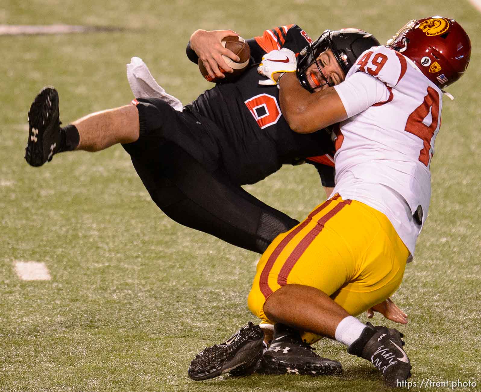 (Trent Nelson  |  The Salt Lake Tribune) USC Trojans defensive lineman Tuli Tuipulotu (49) sacks Utah Utes quarterback Jake Bentley (8), as the Utah Utes host the USC Trojans, NCAA football at Rice-Eccles Stadium in Salt Lake City on Saturday, Nov. 21, 2020.