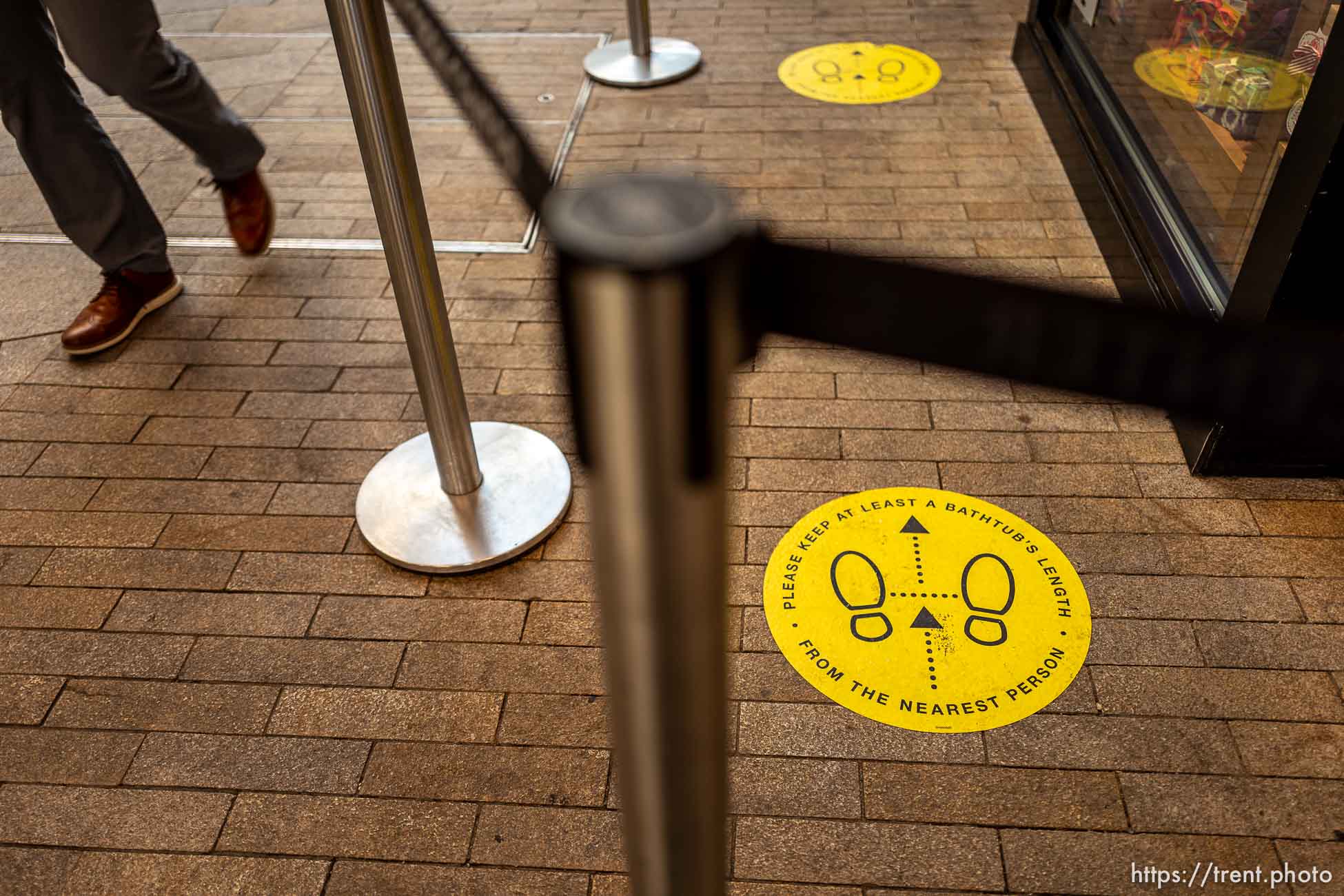 (Trent Nelson  |  The Salt Lake Tribune) Labels call for social distancing in a queue at City Creek in Salt Lake City on Tuesday, Nov. 24, 2020. With office workers, visitors and shoppers in downtown Salt Lake City still way down, businesses in the core are getting inventive on ways to draw customers for the holidays.