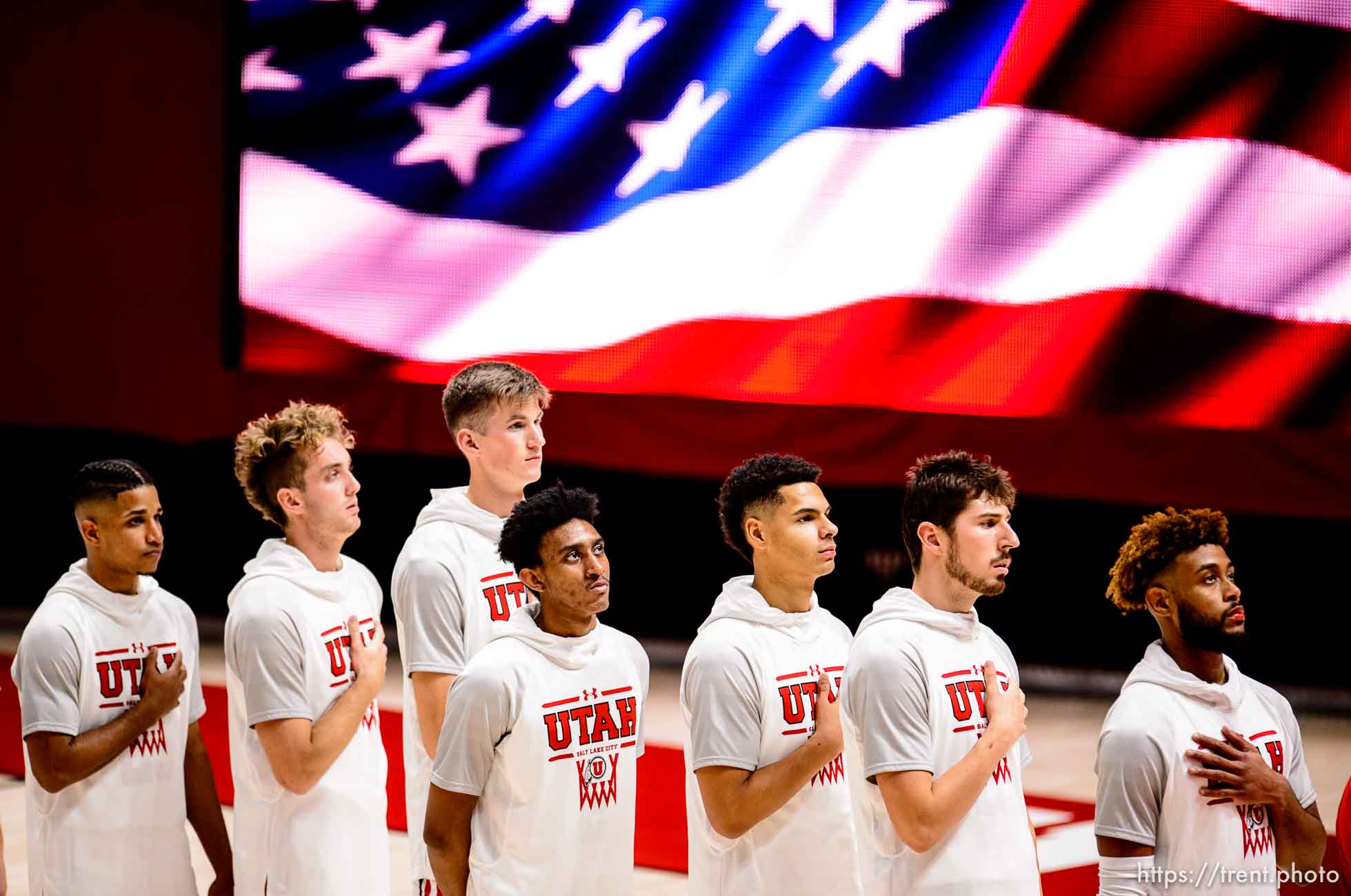 (Trent Nelson  |  The Salt Lake Tribune) Utah players stand for the National Anthem before facing Washington, NCAA basketball in Salt Lake City on Thursday, Dec. 3, 2020.