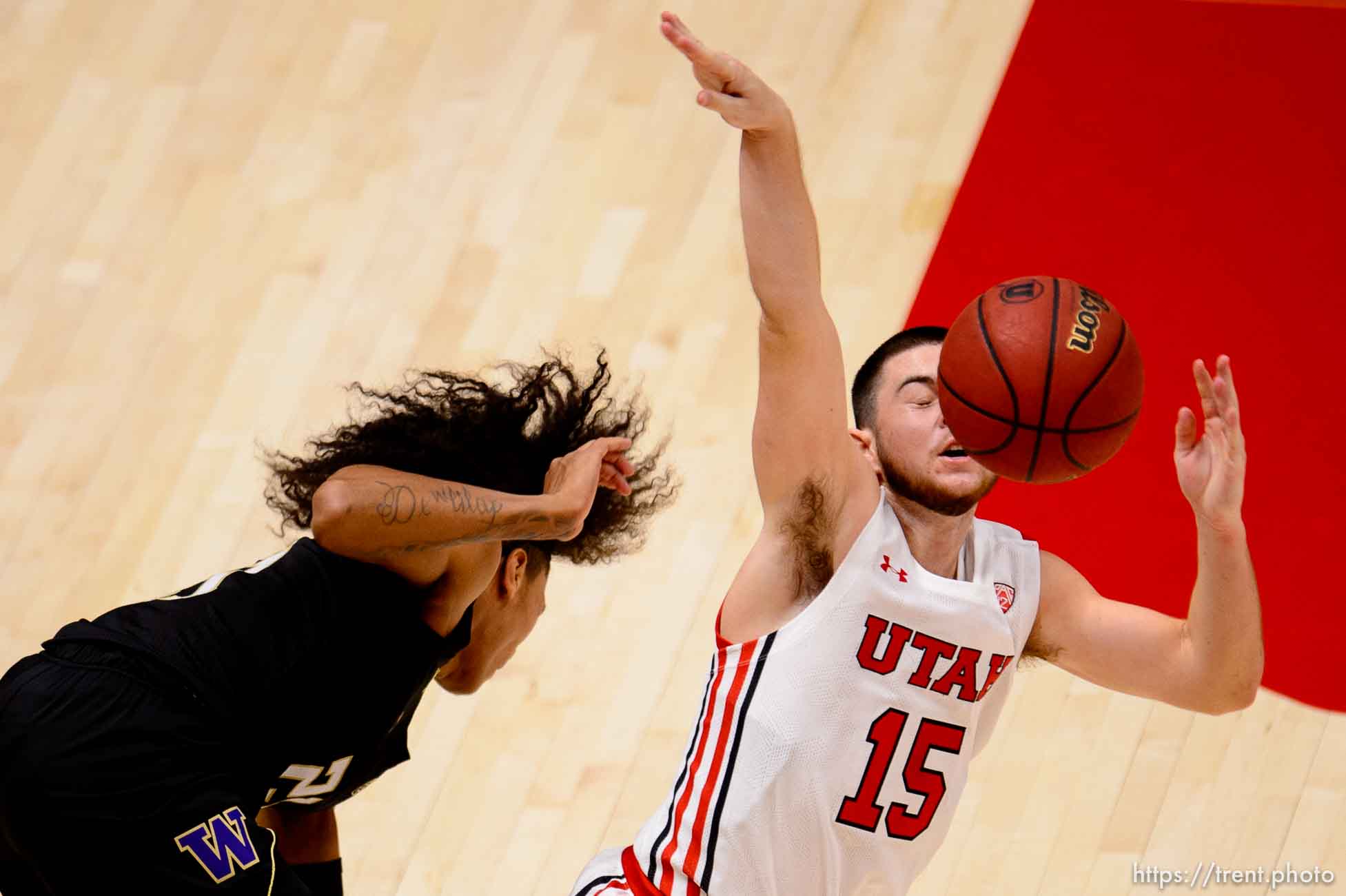 (Trent Nelson  |  The Salt Lake Tribune) Utah's Rylan Jones is fouled by Washington's Raequan Battle as Utah hosts Washington, NCAA basketball in Salt Lake City on Thursday, Dec. 3, 2020.