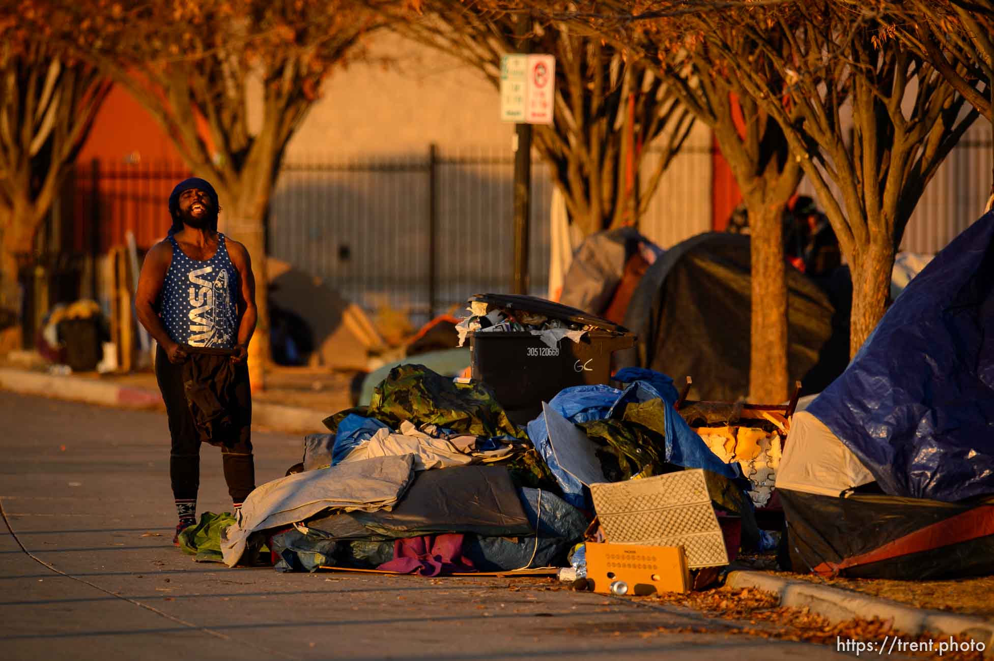 (Trent Nelson  |  The Salt Lake Tribune) Salt Lake City police officers working the cleanup of a series of campsites in Salt Lake City on Wednesday, Dec. 9, 2020.